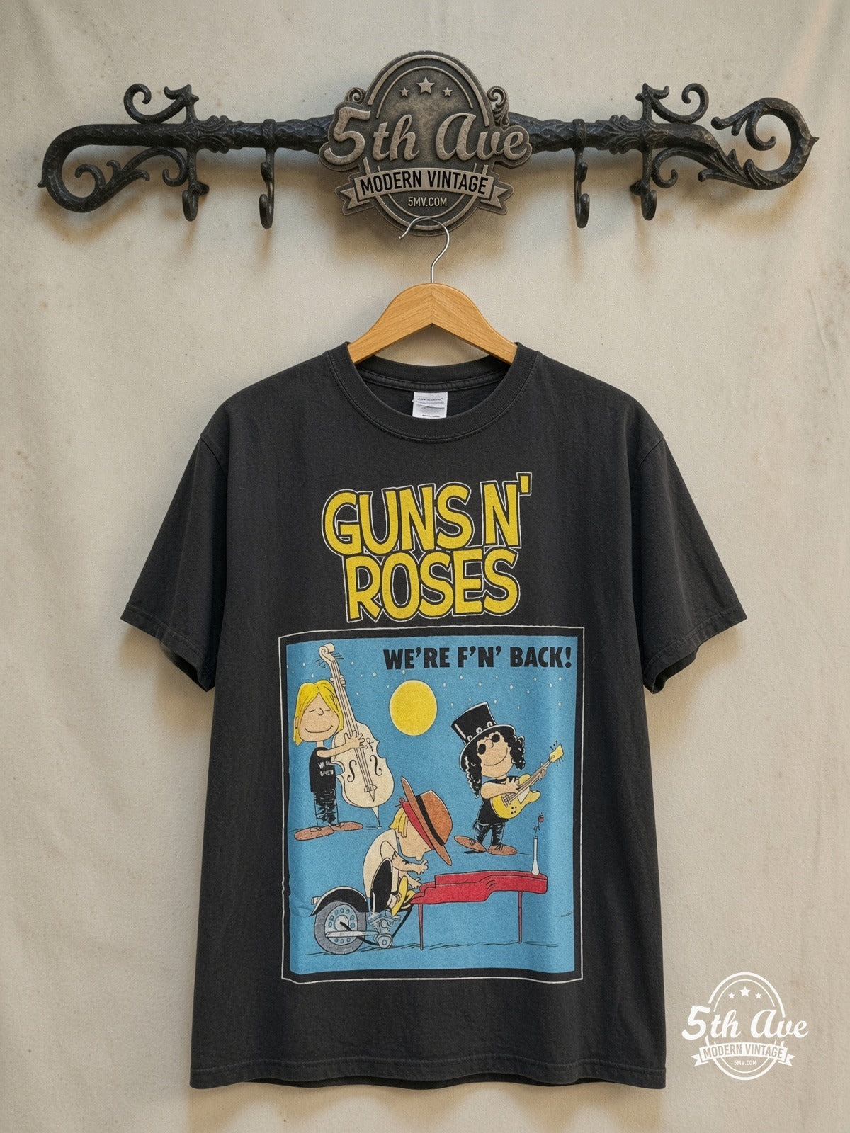 Peanuts – Guns N' Roses x Snoopy 'WE'RE F'N BACK! – New Vintage Graphic Tee — front on locked cream ornate 5th Ave rack