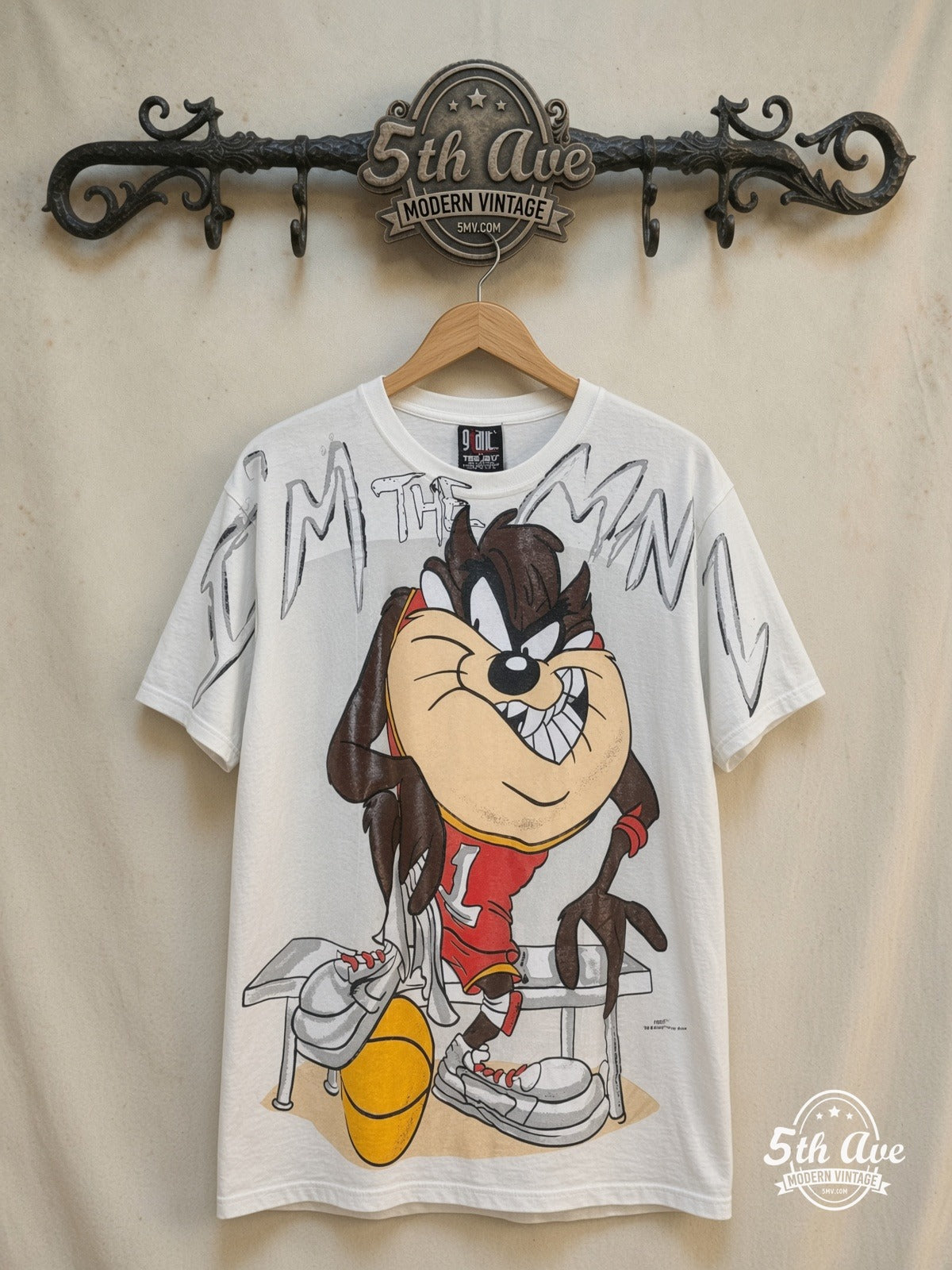 Looney Tunes – Taz-Mania Bold Print – All Over Print – New Vintage Graphic Tee — front on locked cream ornate 5th Ave rack