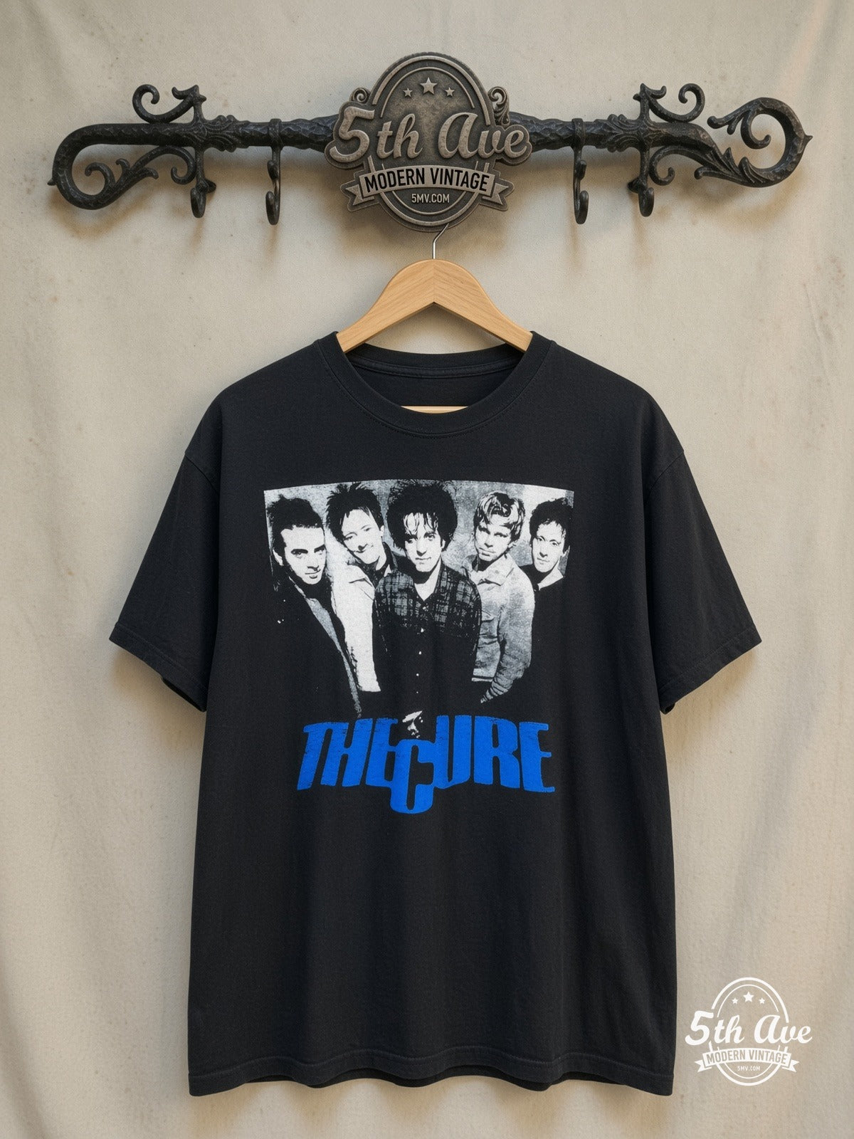 The Cure – Five Member Photo Blue Logo – Vintage Band T-Shirt — front on locked cream ornate 5th Ave rack