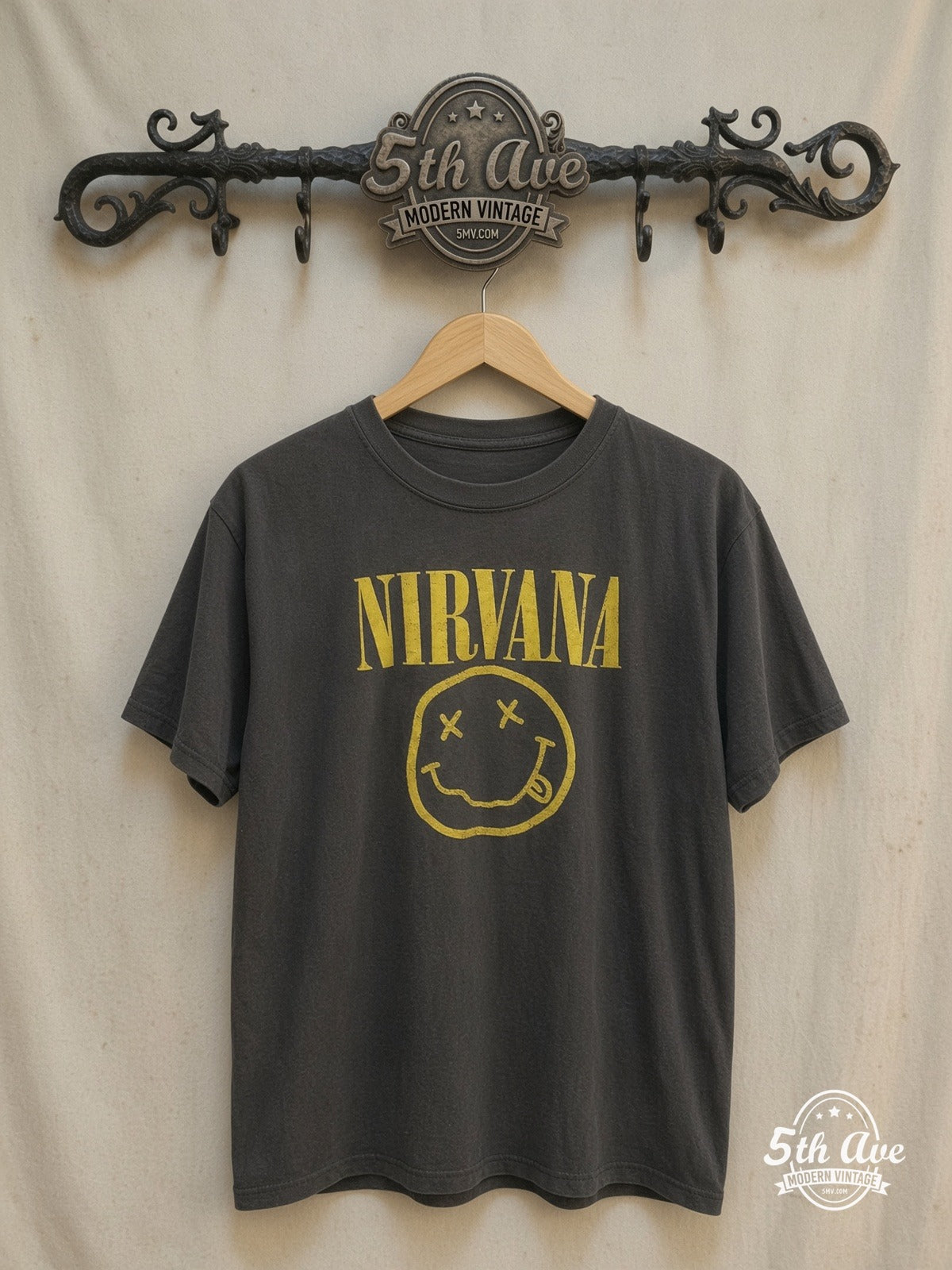 Nirvana – with Kurt Cobain's Sub Pop Records Sketch – Vintage Band T-Shirt — front on locked cream ornate 5th Ave rack