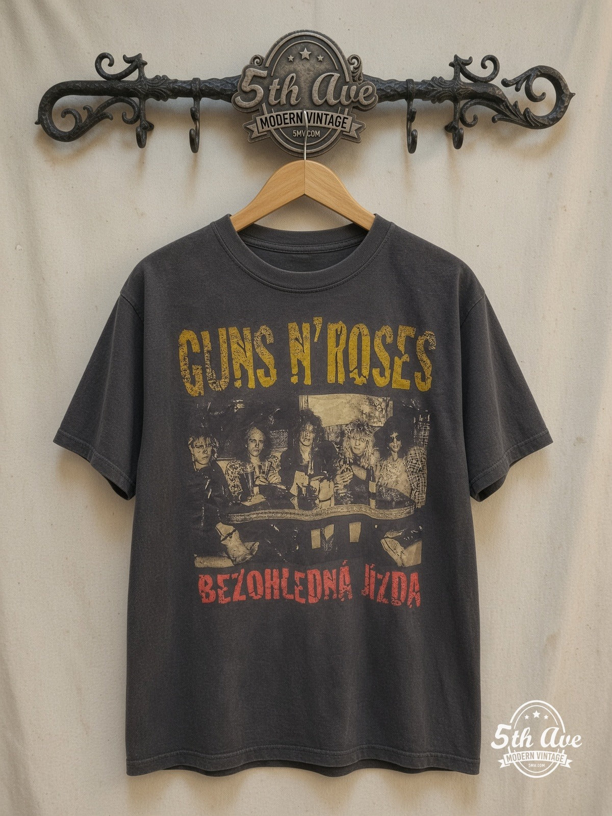 Faded Noir: The Ultimate Guns N' Roses Vintage-Feel Streetwear Tee – Vintage Band T-Shirt — front on locked cream ornate 5th Ave rack