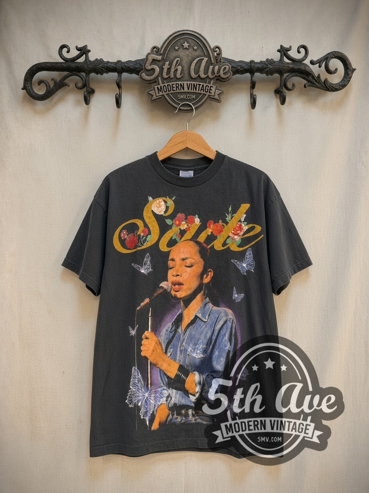 Sade The Best of Sade vintage band t-shirt in black, front view on a display rack