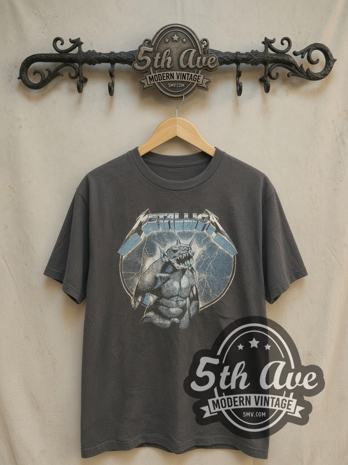 Metallica Ride the Lightning' Monster Beast and Electric Chair Cotton vintage band t-shirt, front view on a display rack