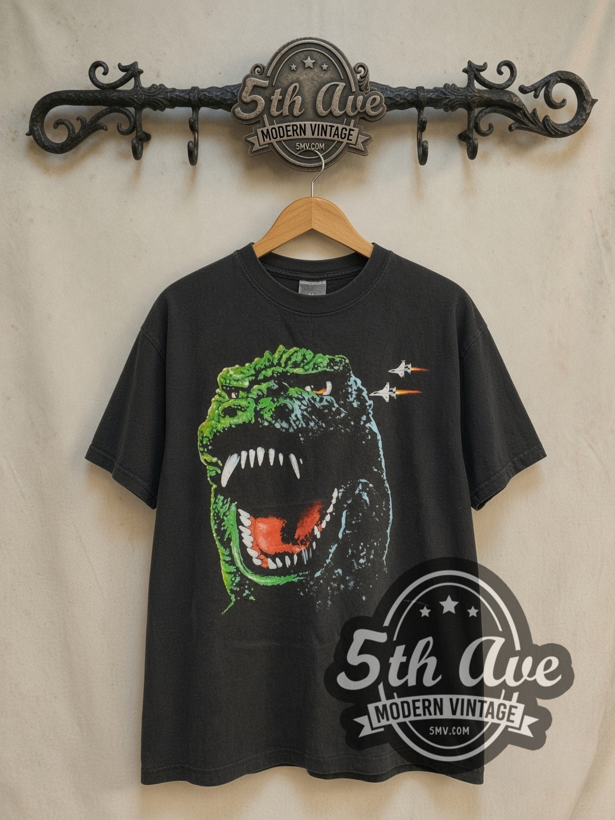 Godzilla King of the Monsters 1994 vintage graphic t-shirt, front view on a display rack