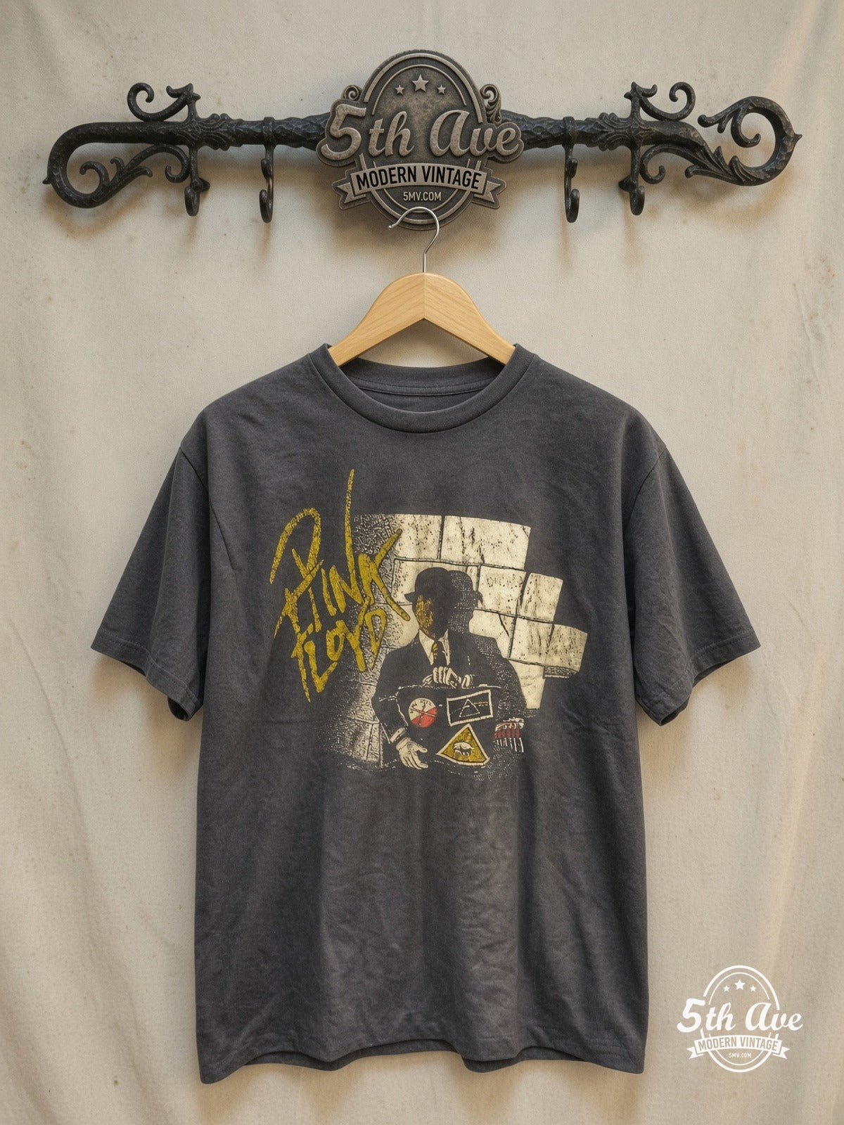 Pink Floyd – Wall and Derby Figure – Vintage Band T-Shirt — front on locked cream ornate 5th Ave rack