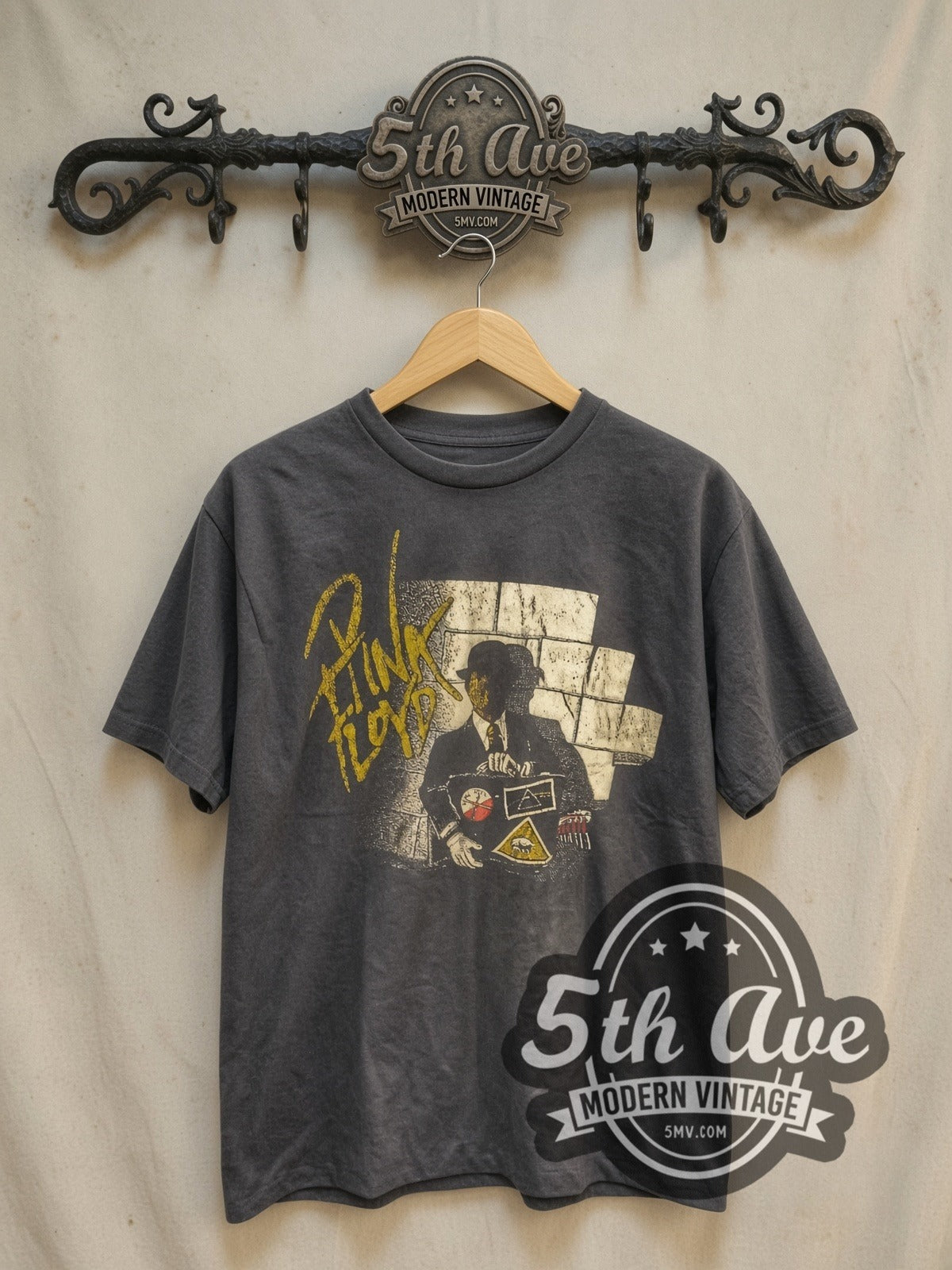 Pink Floyd Wall and Derby Figure vintage band t-shirt, front view on a display rack