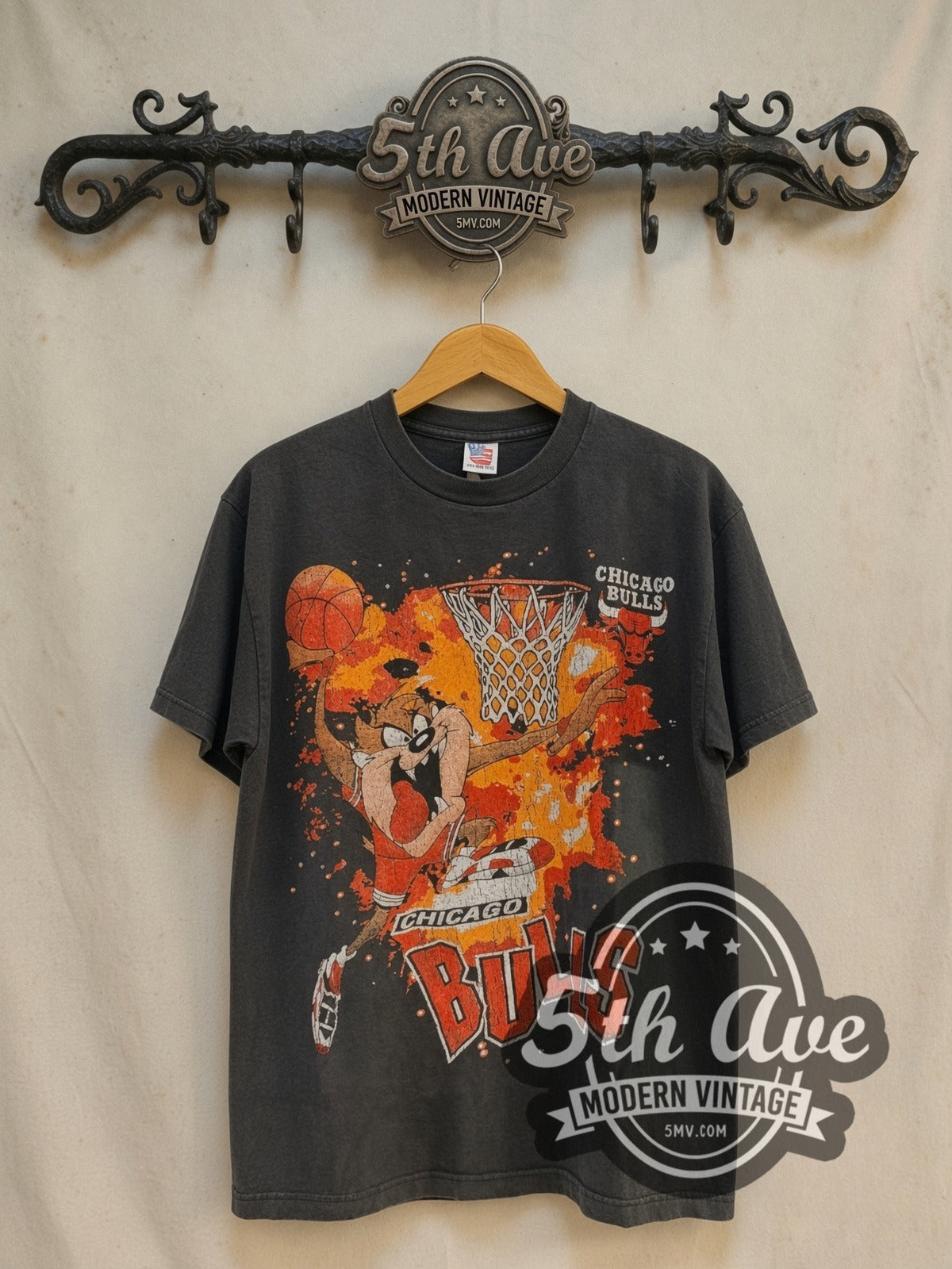 Looney Tunes Taz-Mania x Chicago Bulls vintage cartoon tee in black, front view on a display rack
