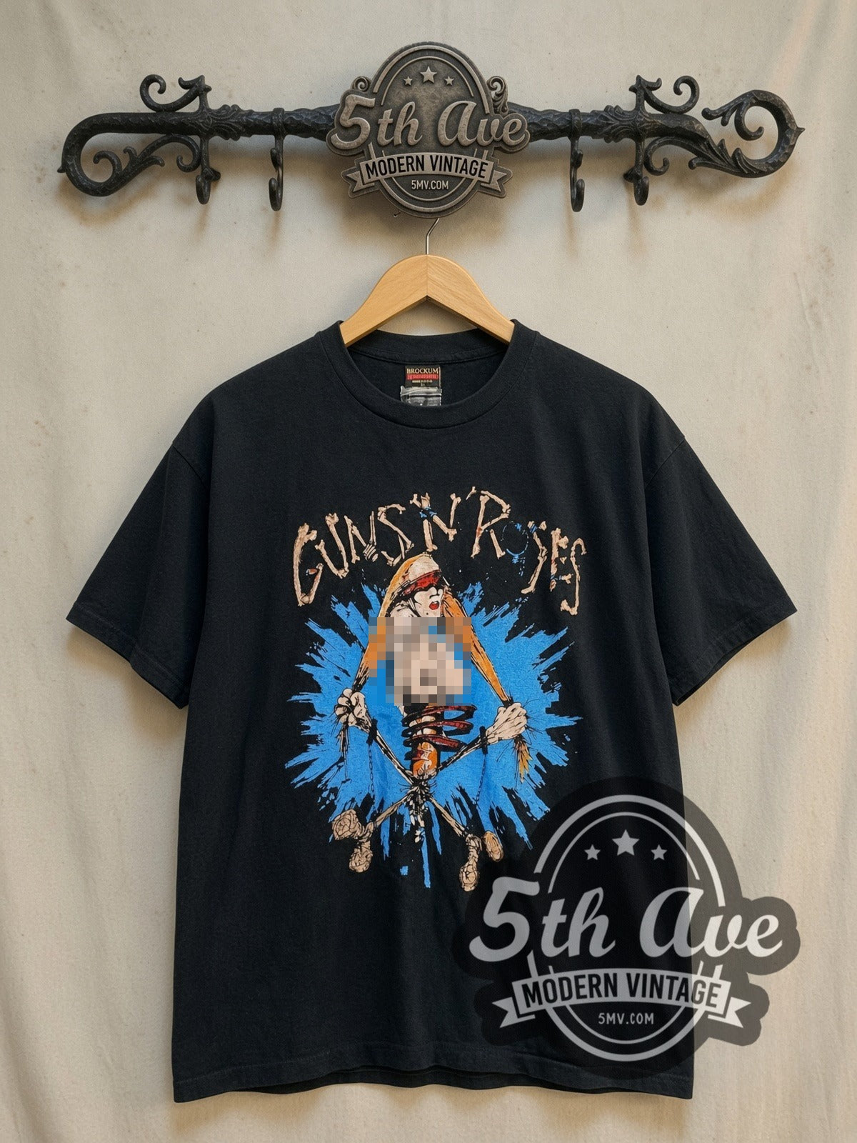 Guns N' Roses Pretty Tied Up Tour 1992 vintage band t-shirt, front view on a display rack