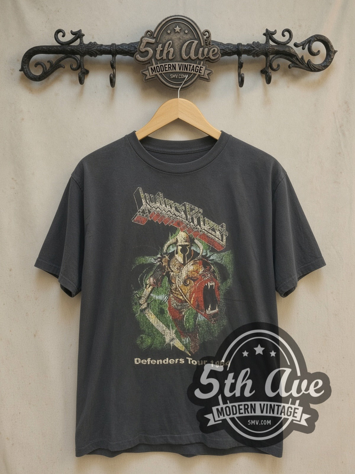 Judas Priest Defenders Tour 1984 vintage band t-shirt, front view on a display rack