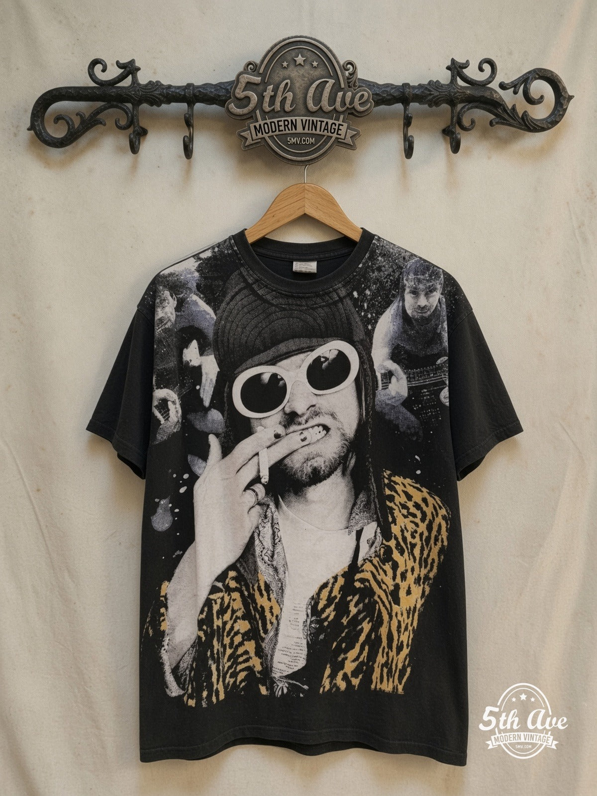 Nirvana – Kurt Cobain Mosquito Head – Vintage Band T-Shirt — front on locked cream ornate 5th Ave rack