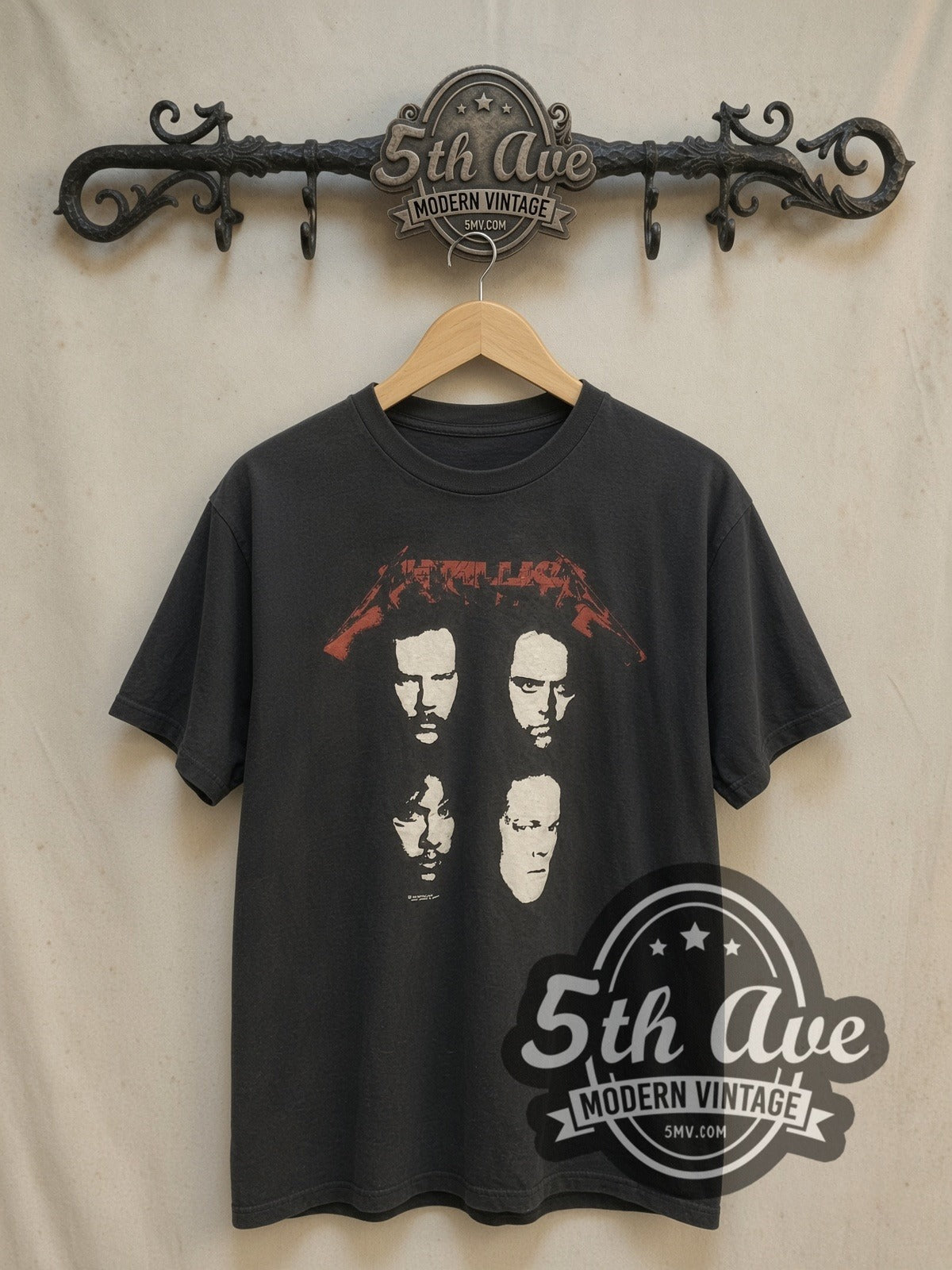 Metallica Faces and World Tour 'Don't Tread On Me' Snake vintage band t-shirt, front view on a display rack