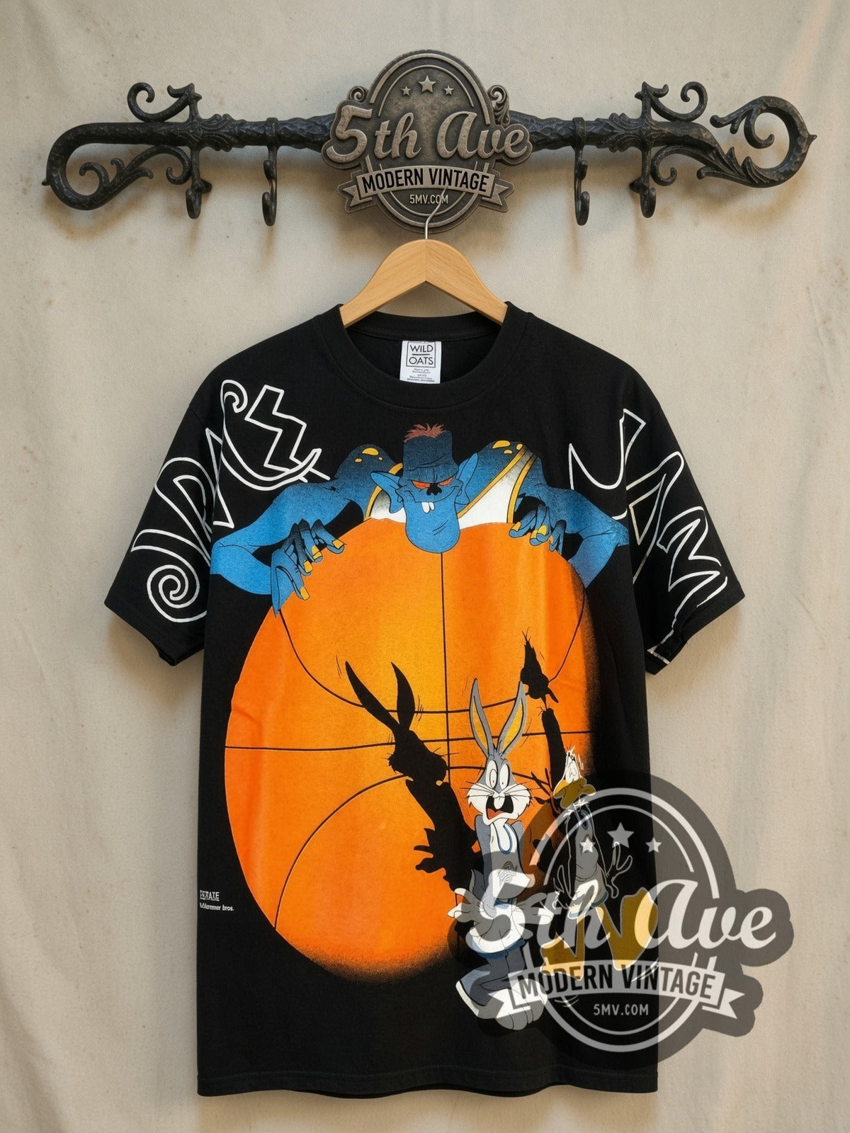 Looney Tunes Space Jam Bugs Bunny and Daffy Duck all-over-print vintage cartoon tee, front view on a display rack
