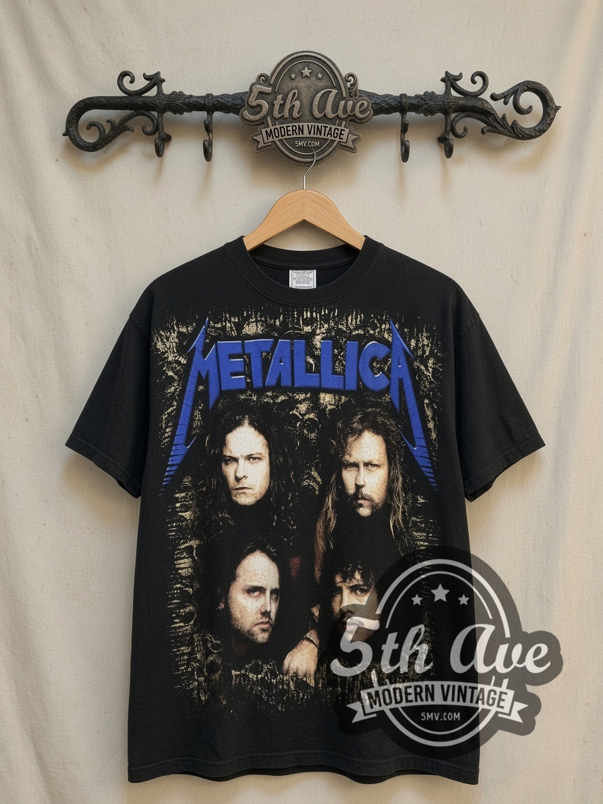 Metallica Enter Sandman all-over-print vintage band t-shirt, front view on a display rack