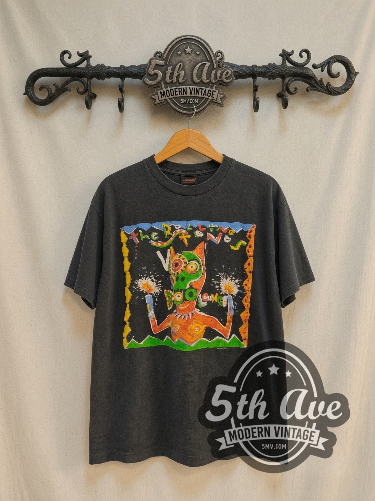 The Rolling Stones Voodoo Lounge World Tour 1994 vintage band t-shirt in black, front view on a display rack