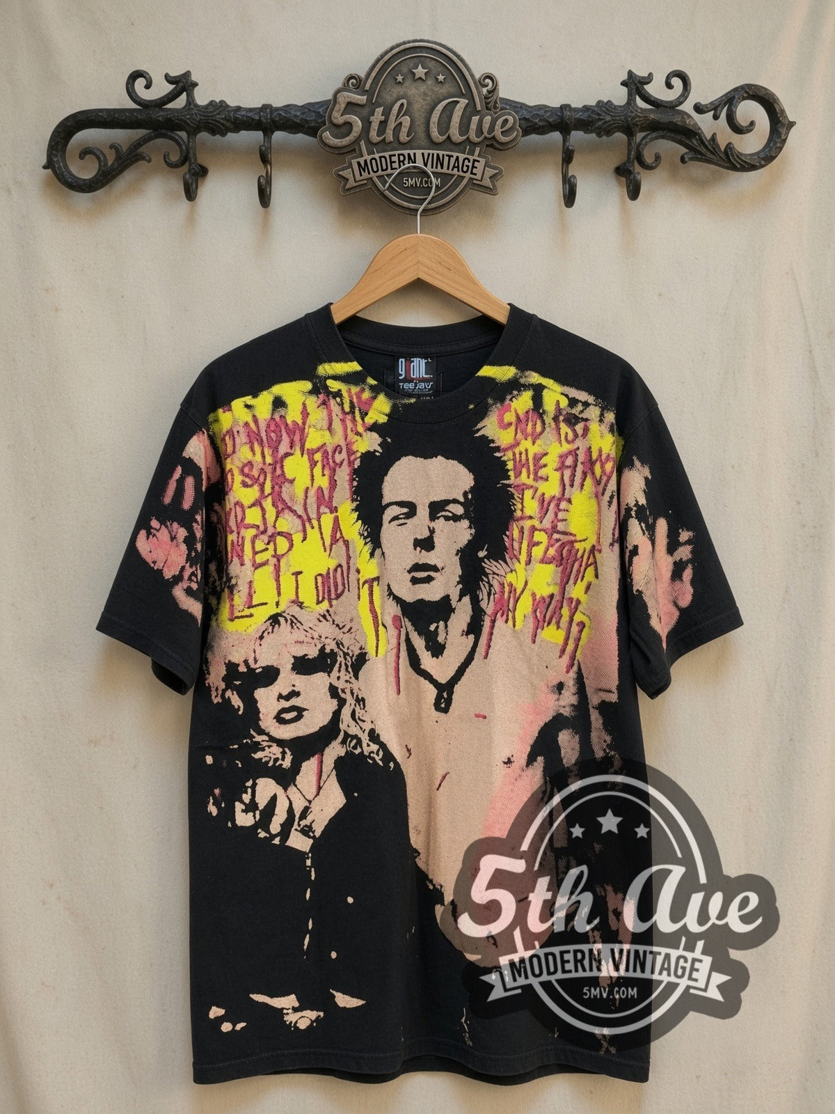Sex Pistols Sid Vicious vintage band t-shirt, front view on a display rack