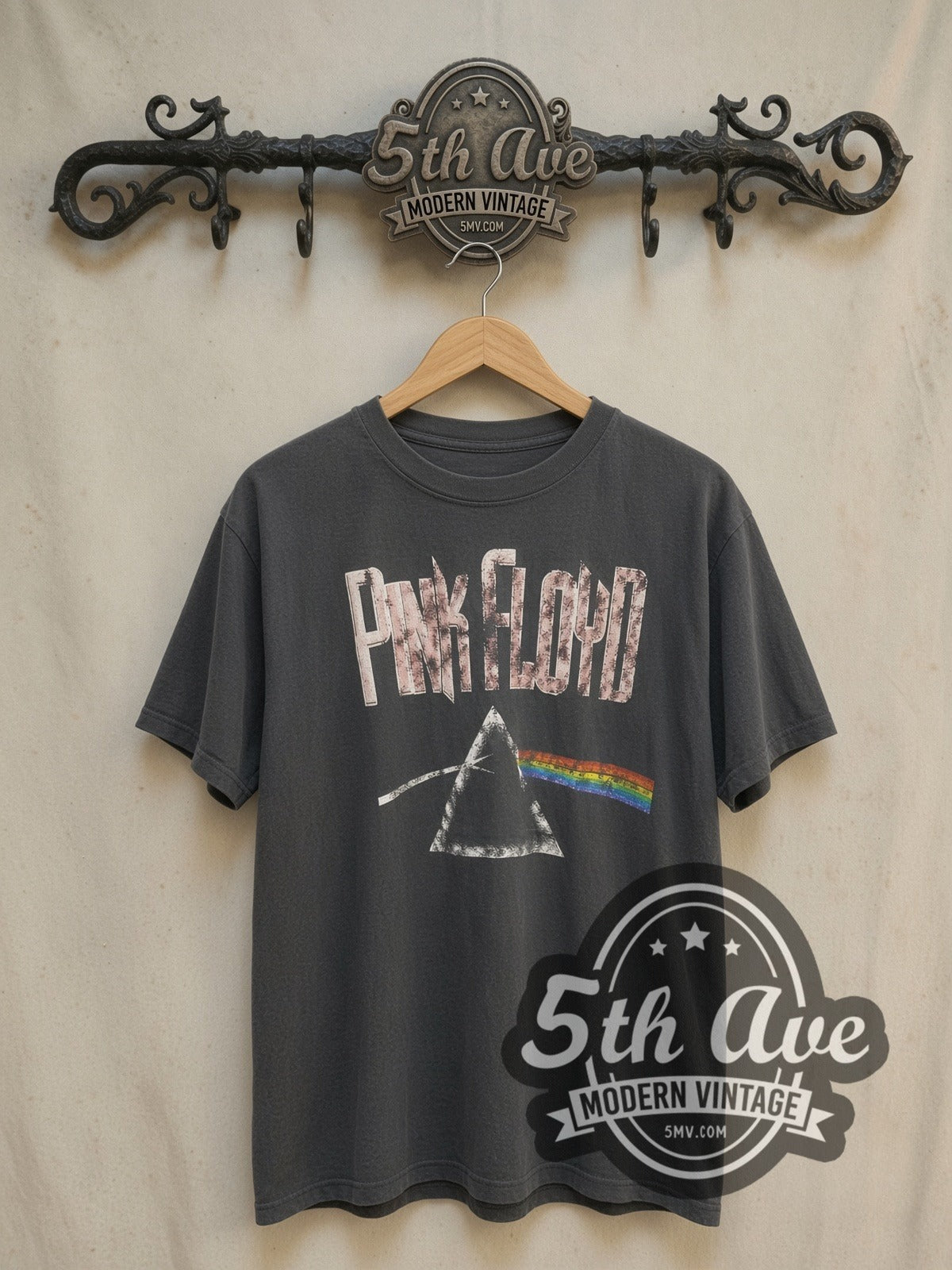 Pink Floyd Dark Side of the Moon Prism vintage band t-shirt, front view on a display rack