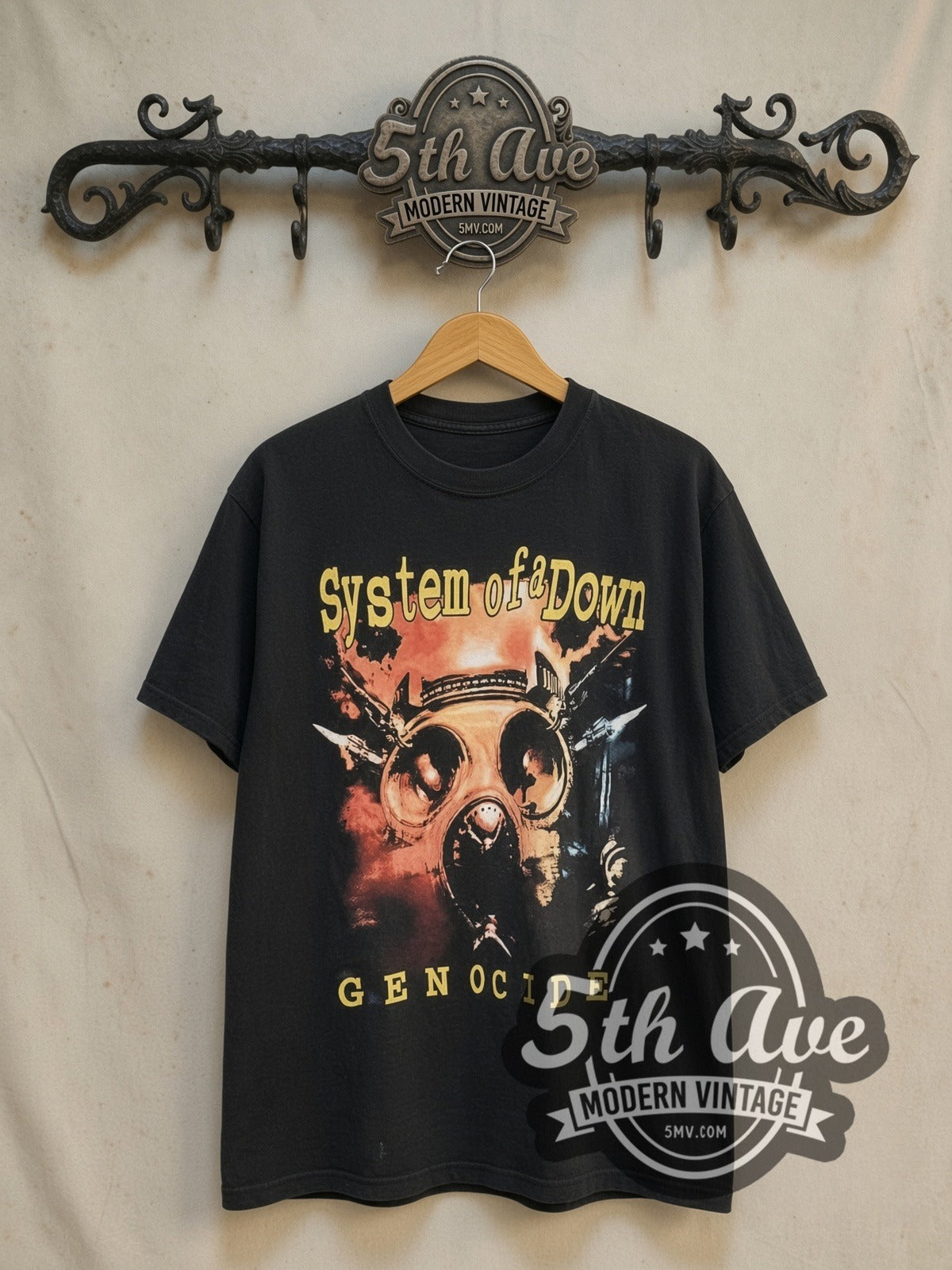 System of a Down Genocide vintage band t-shirt in black, front view on a display rack