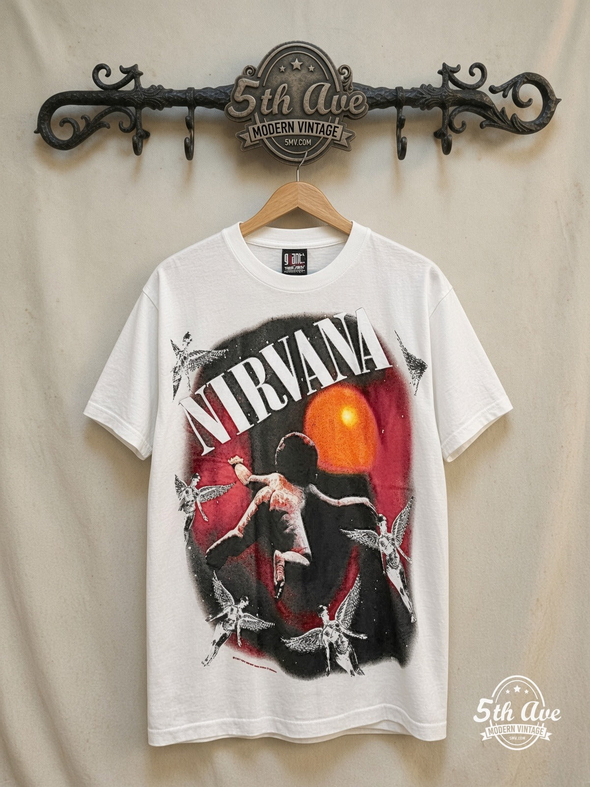 Nirvana – Nevermind Baby & Angels Oval – Vintage Band T-Shirt — front on locked cream ornate 5th Ave rack