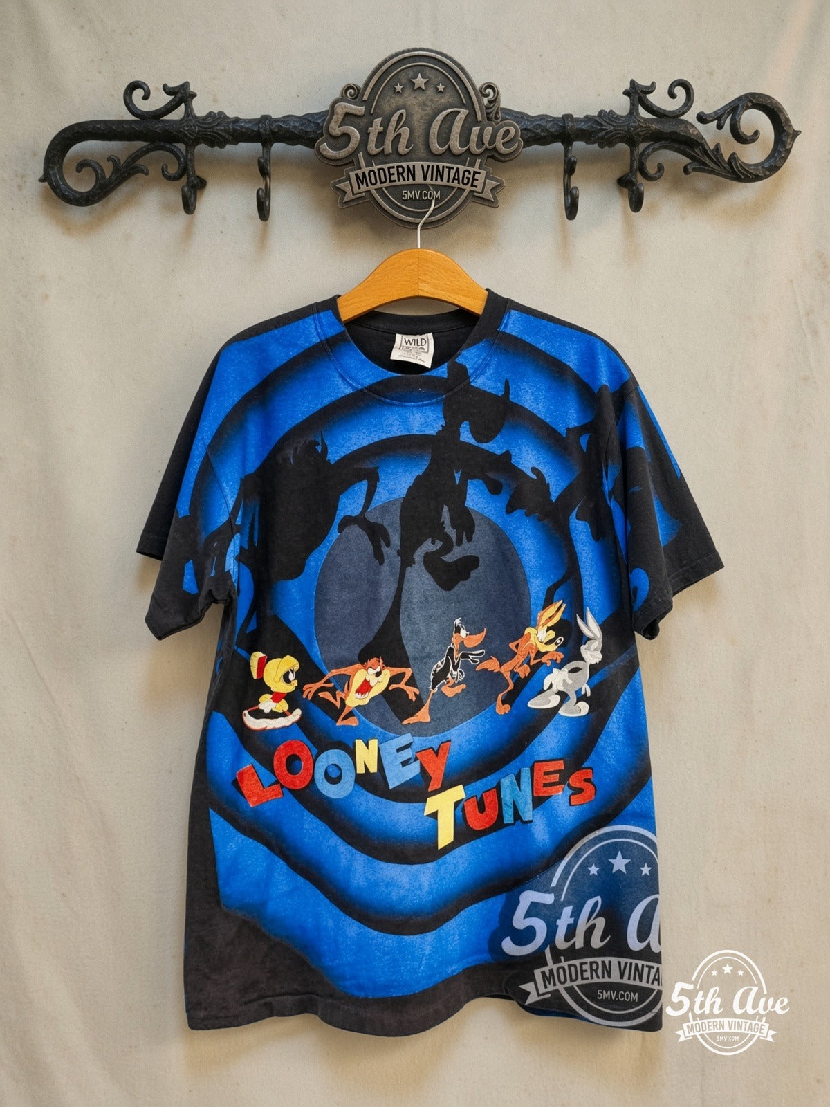 Looney Tunes – Looney Tunes – All Over Print – New Vintage Graphic Tee — front on locked cream ornate 5th Ave rack