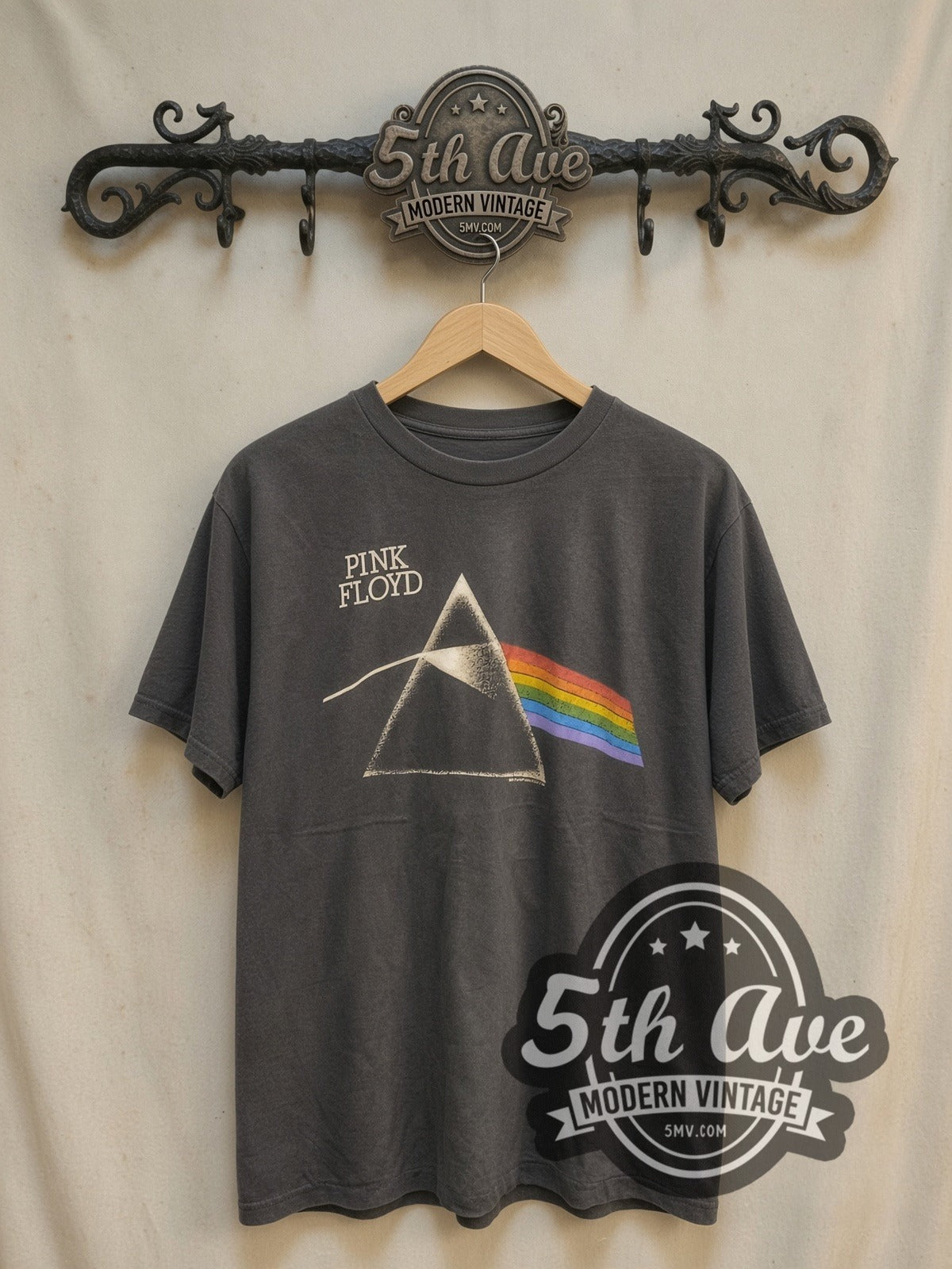 Pink Floyd Dark Side of the Moon' Prism vintage band t-shirt, front view on a display rack