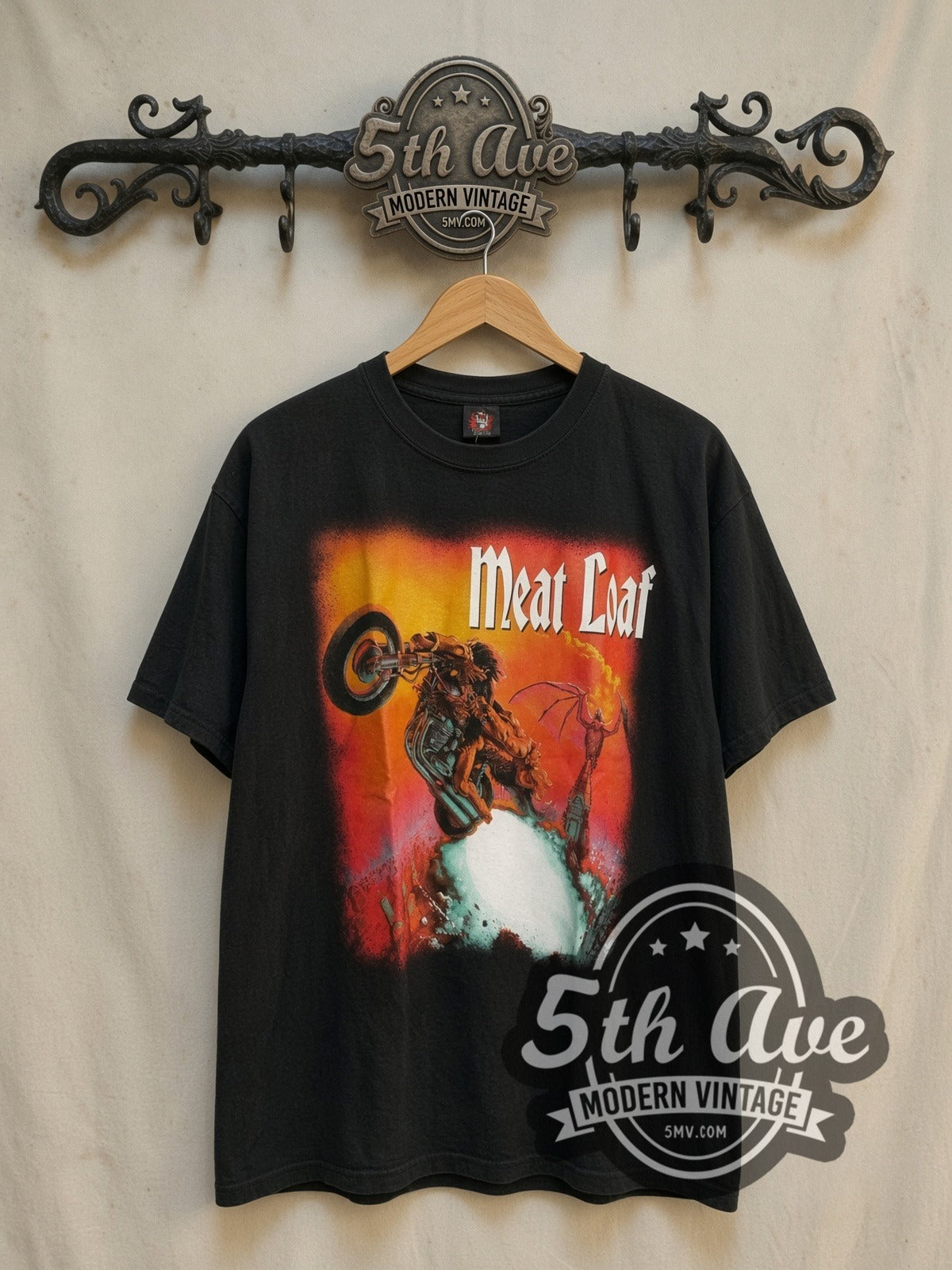 Meat Loaf European Tour 1999 vintage band t-shirt, front view on a display rack