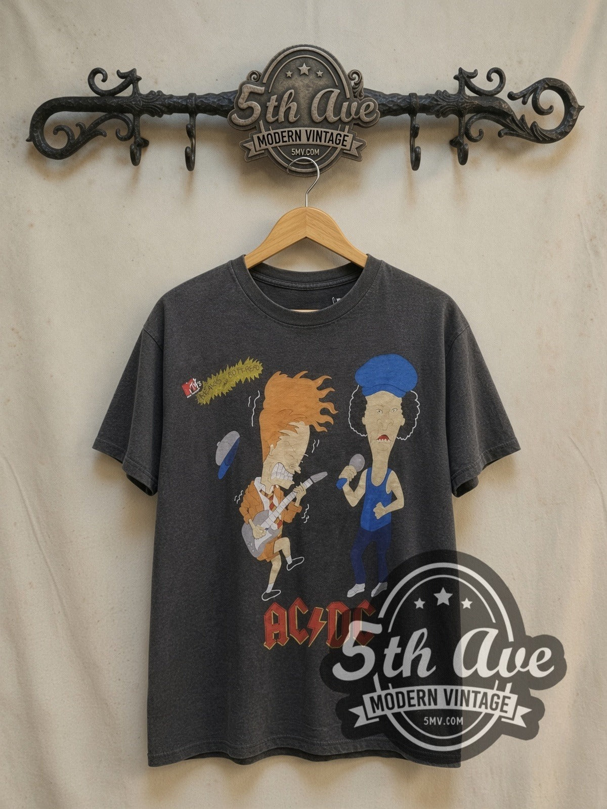 AC/DC MTV Beavis and Butthead Rock vintage band t-shirt, front view on a display rack