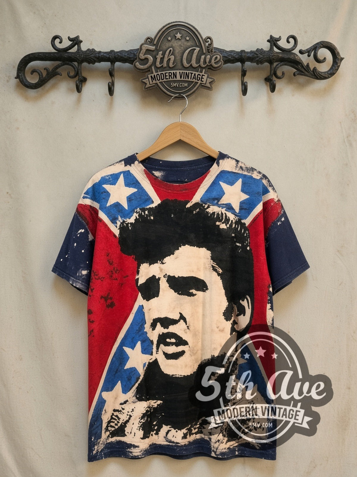 Elvis Presley King of Rock and Roll all-over-print vintage band t-shirt, front view on a display rack