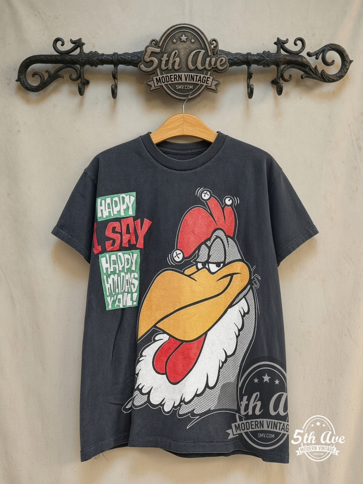 Looney Tunes Foghorn Leghorn Happy Holidays vintage cartoon tee in black, front view on a display rack