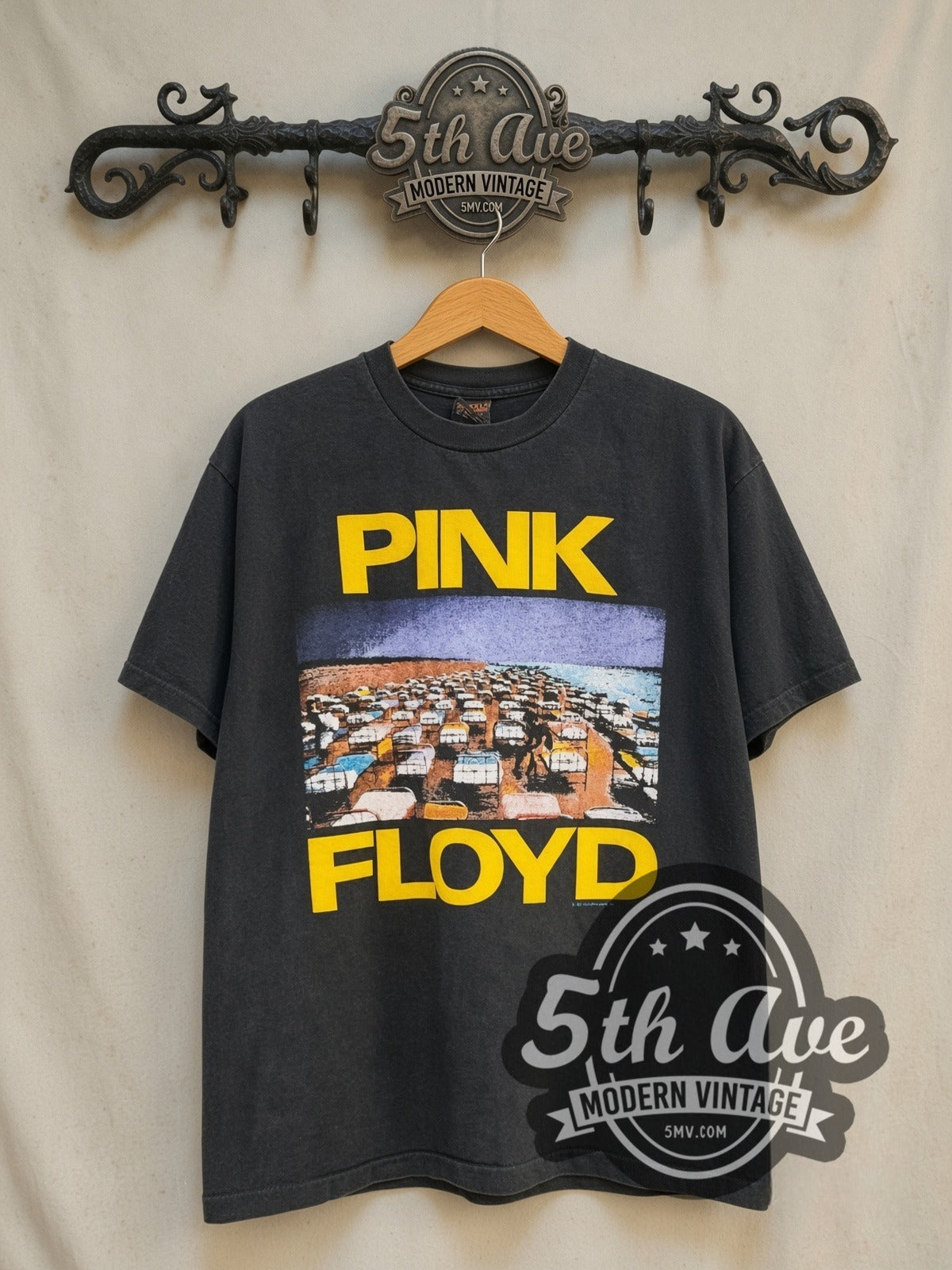 Pink Floyd World Tour' 1987 vintage band t-shirt in black, front view on a display rack