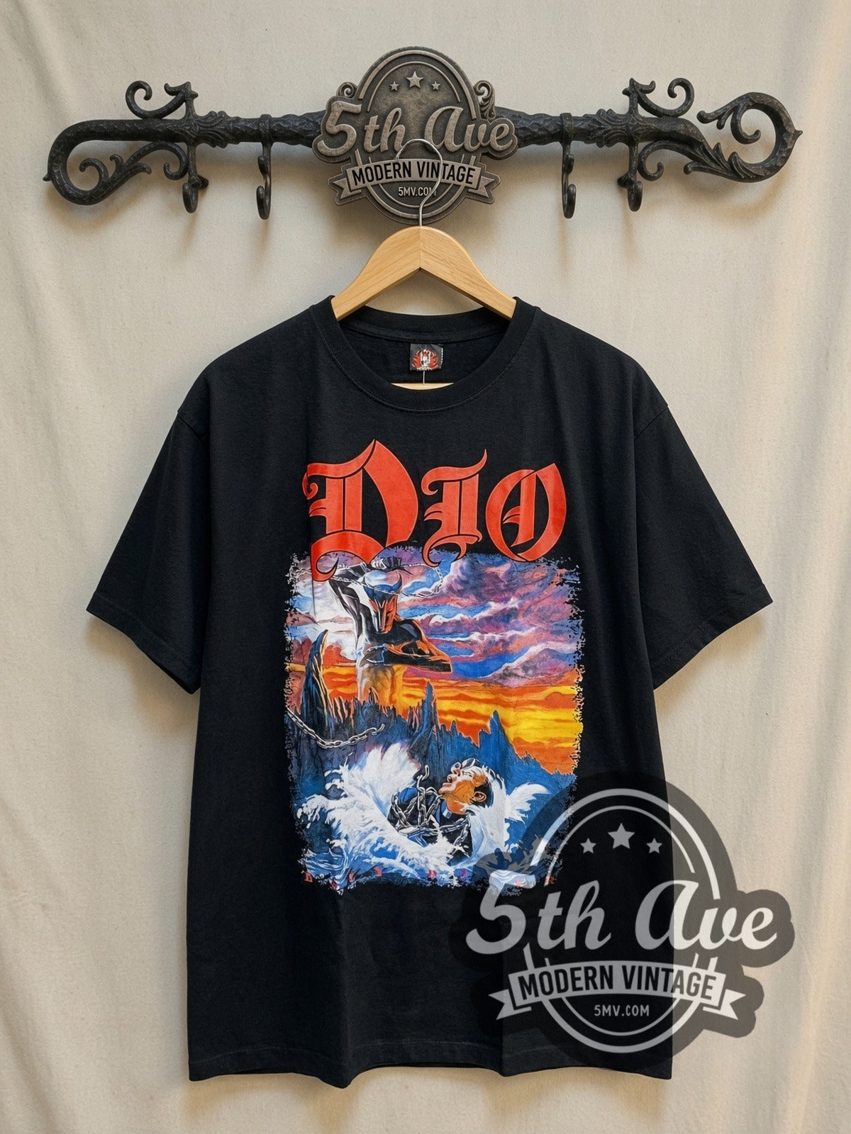 Dio Holy Diver Full Scene Priest Drowning vintage band t-shirt, front view on a display rack