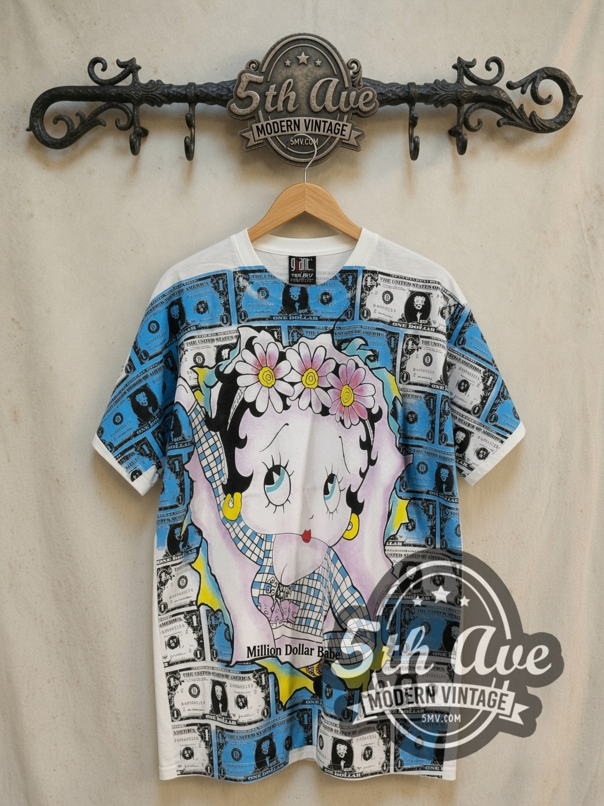 Betty Boop Million Dollar Babe all-over-print vintage cartoon tee, front view on a display rack