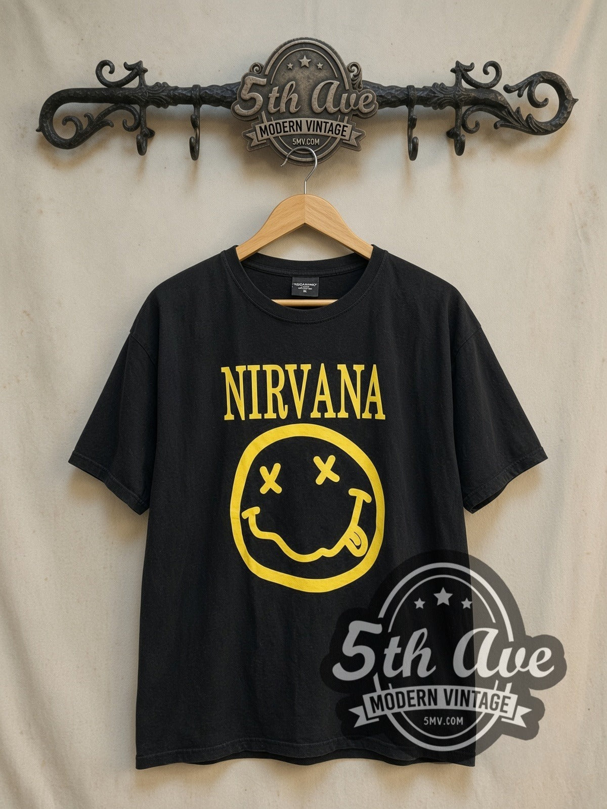Nirvana Classic Yellow Smiley Face Logo vintage band t-shirt, front view on the 5MV rack