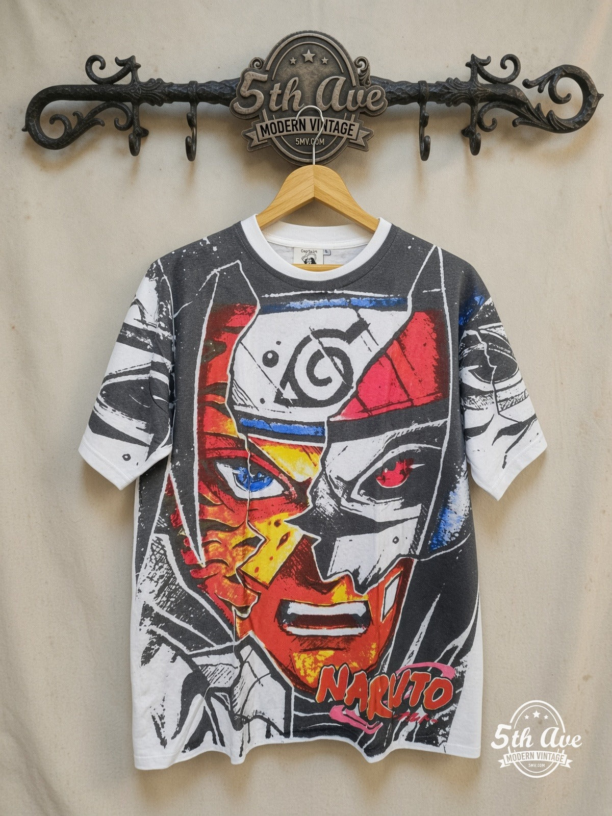 Naruto Shippuden – Split Face Hidden Leaf All Over Print – New Vintage Anime Tee — front on locked cream ornate 5th Ave rack