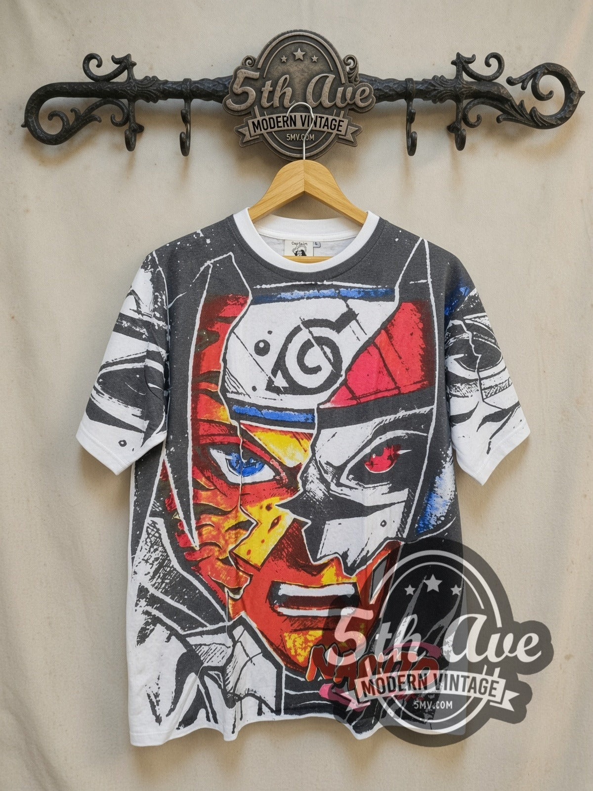 Naruto Shippuden Split Face Hidden Leaf all-over-print vintage graphic t-shirt, front view on a display rack