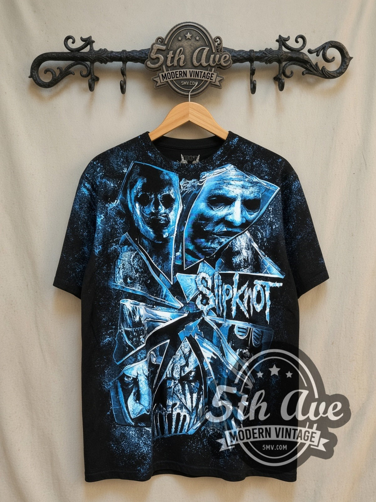 Slipknot The Devil in I all-over-print vintage band t-shirt, front view on a display rack