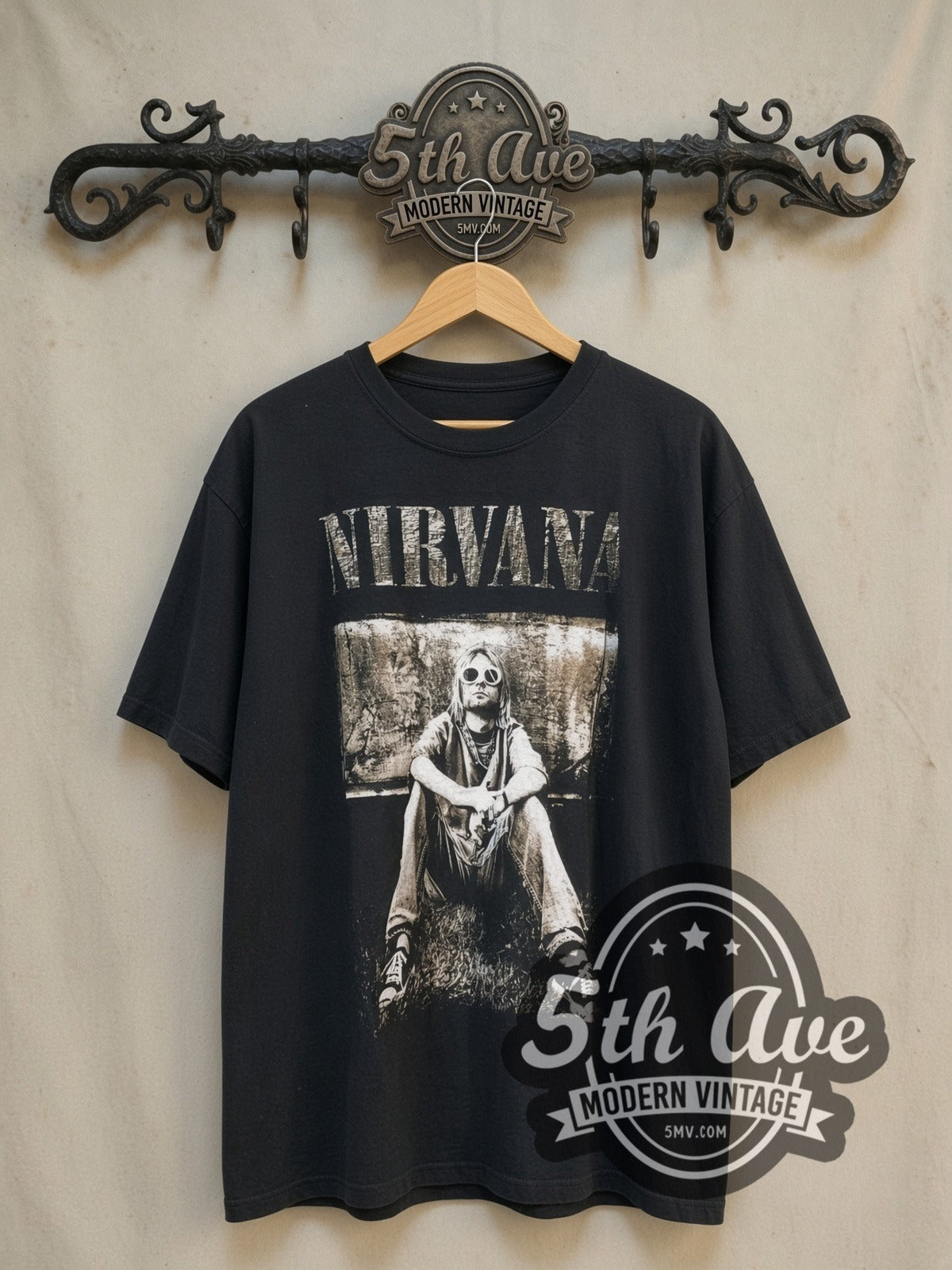 Kurt Cobain Nirvana Retro Portrait vintage band t-shirt, front view on a display rack