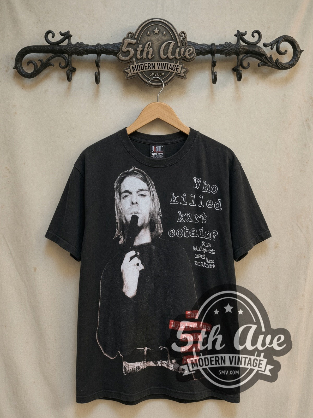 Kurt Cobain Who Killed Kurt Cobain vintage band t-shirt, front view on a display rack