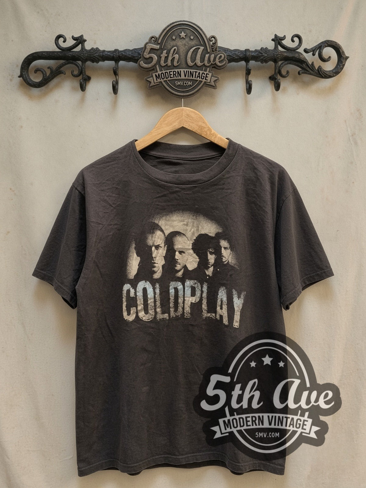 Coldplay Band Photo Logo vintage band t-shirt, front view on a display rack