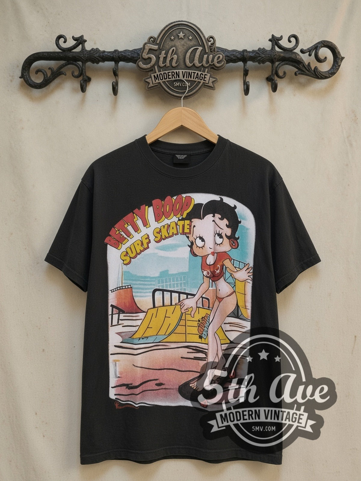 Betty Boop I'm Good at Surf Skate vintage cartoon tee, front view on a display rack