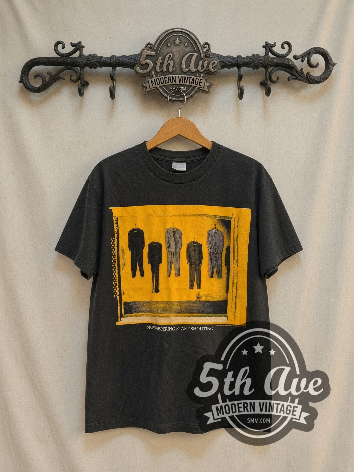 Radiohead Stop Whispering vintage band t-shirt in black, front view on a display rack
