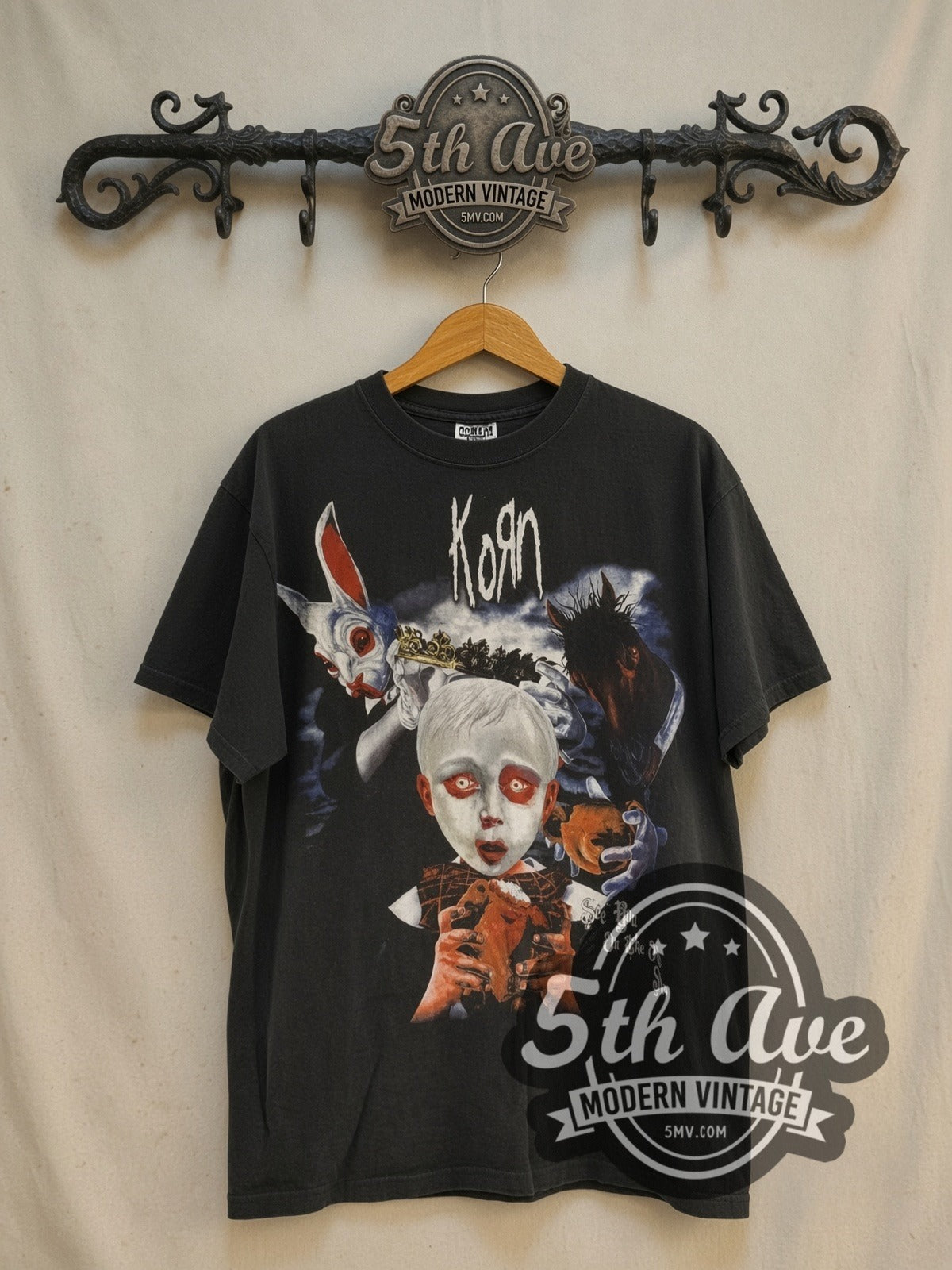 Korn Tour 2006 vintage band t-shirt in black, front view on a display rack