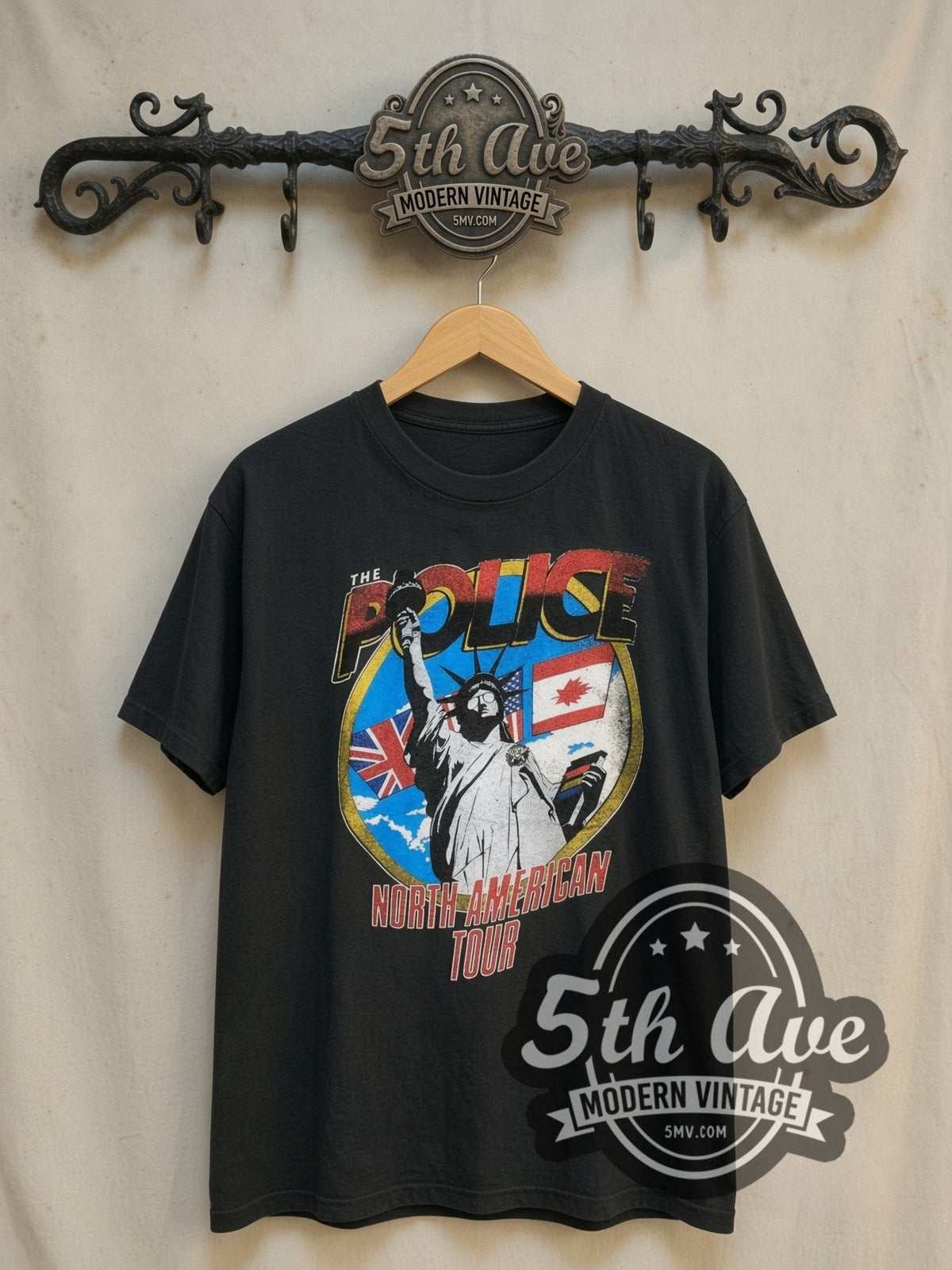 The Police North American Tour 1983 vintage band t-shirt, front view on a display rack