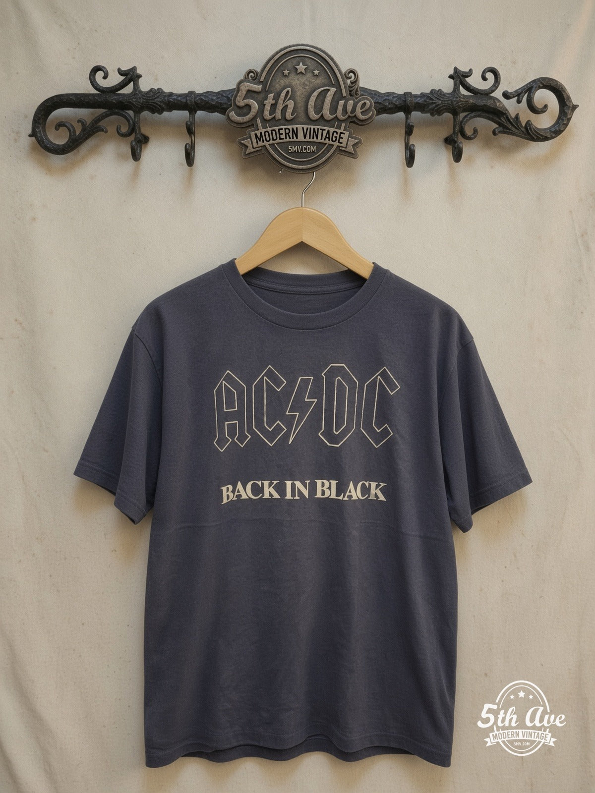 AC/DC – Back in Black t shirt – Vintage Band T-Shirt — front on locked cream ornate 5th Ave rack
