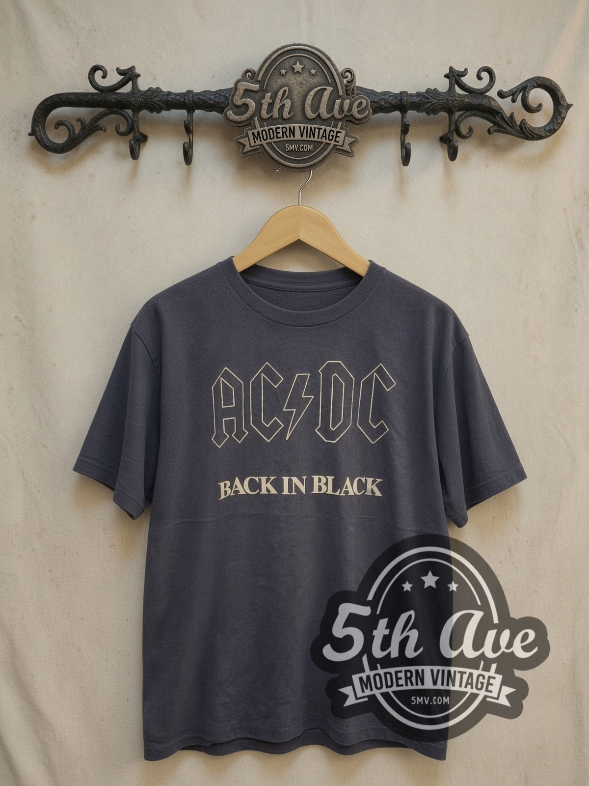 AC/DC Back in Black vintage band t-shirt in black, front view on a display rack
