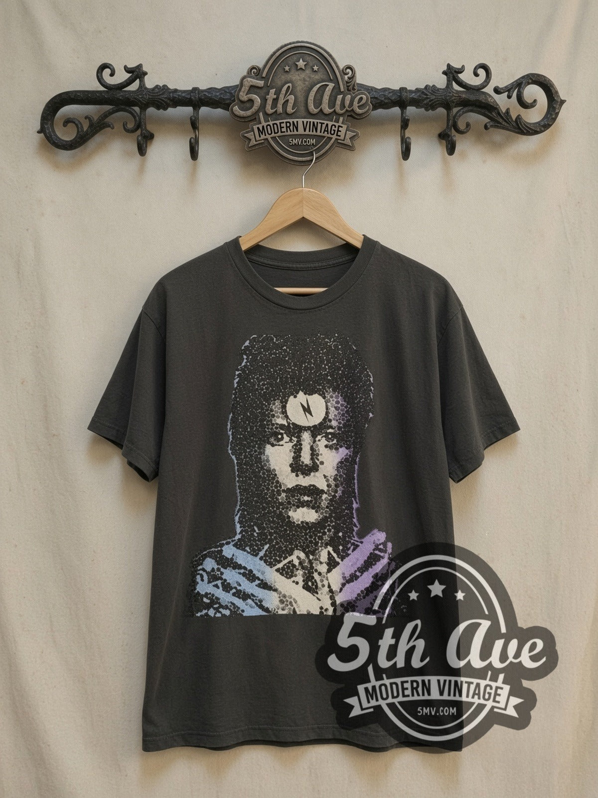 David Bowie Enigmatic Resonance Portrait vintage band t-shirt, front view on a display rack