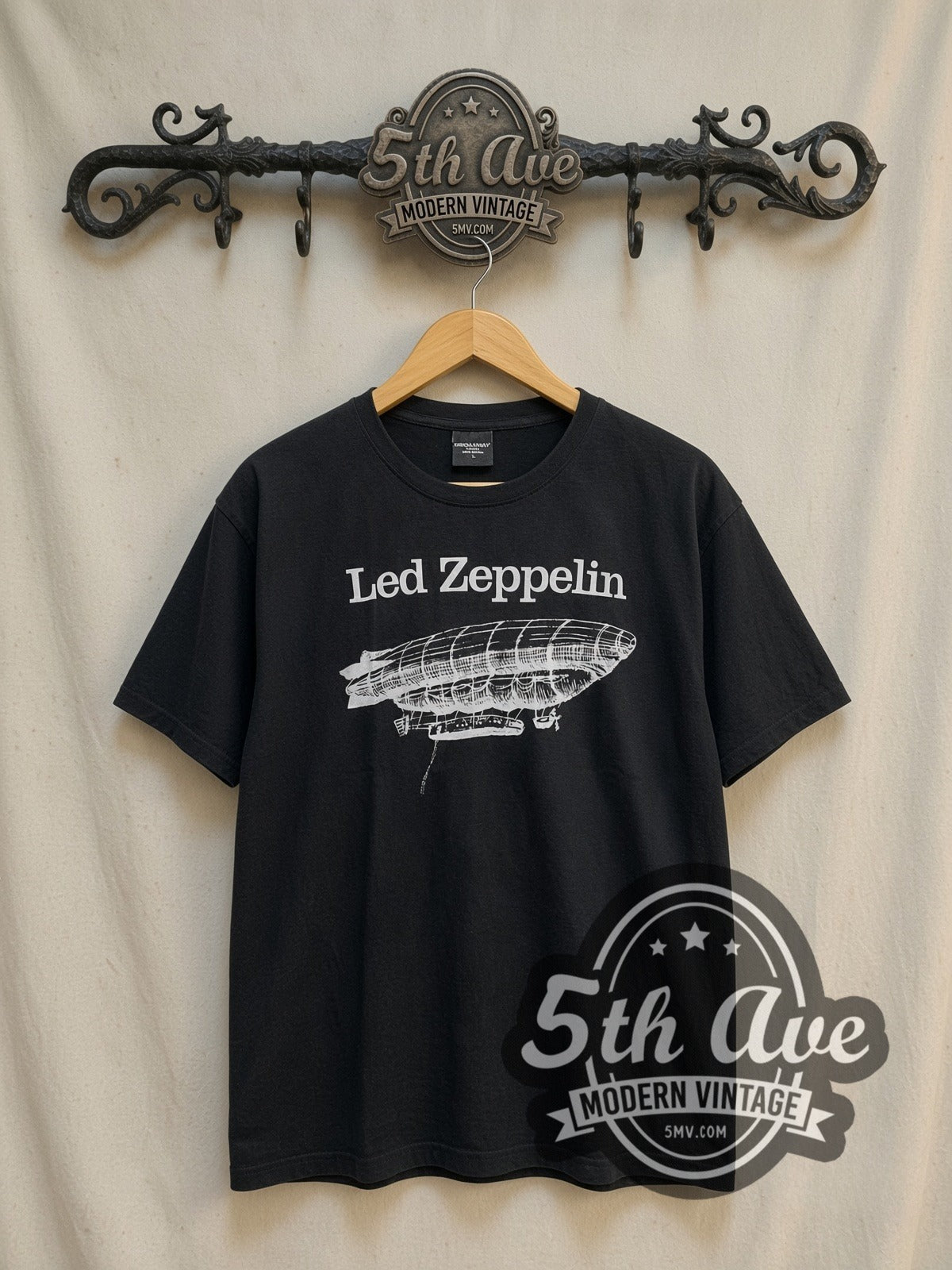 Led Zeppelin White Zeppelin Airship Logo vintage band t-shirt in black, front view on a display rack
