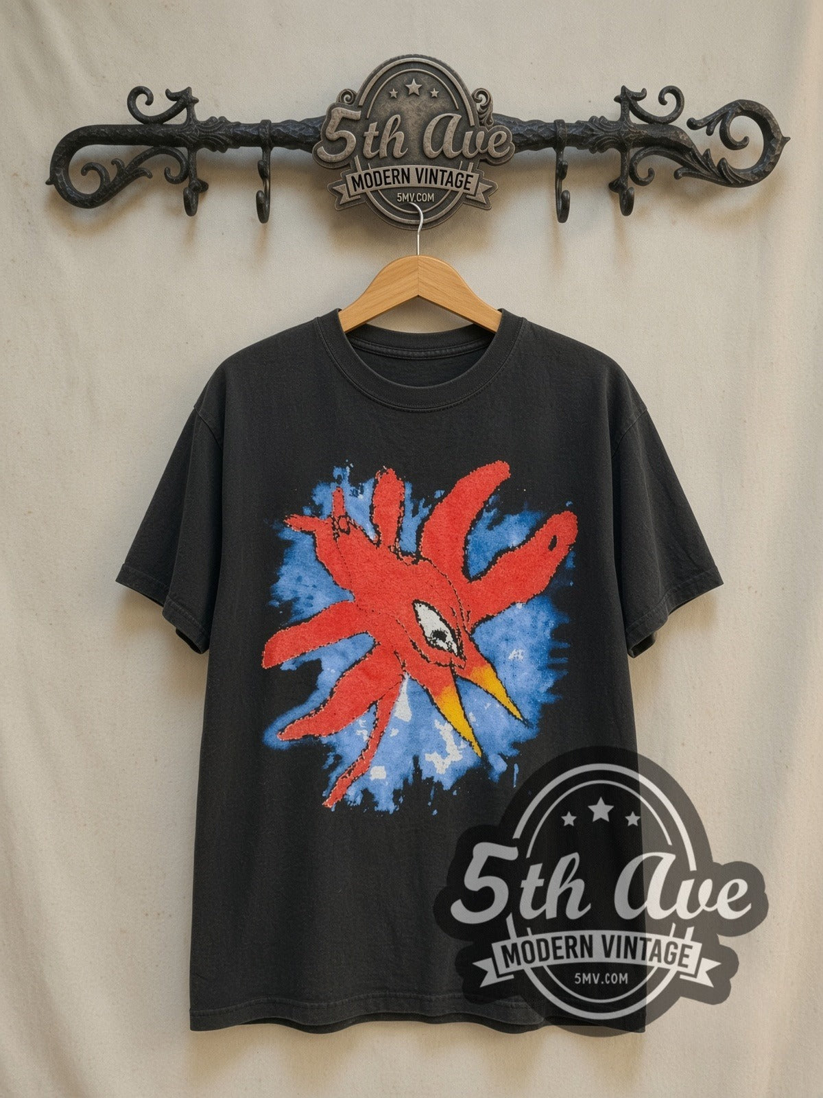 The Cure Wish Tour 1992 vintage band t-shirt in black, front view on a display rack