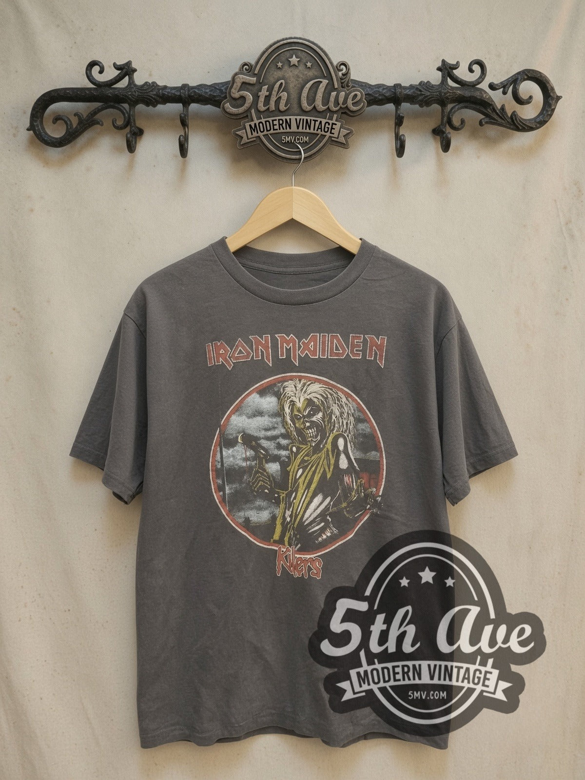 Iron Maiden Killers Circular Eddie Hatchet vintage band t-shirt, front view on a display rack