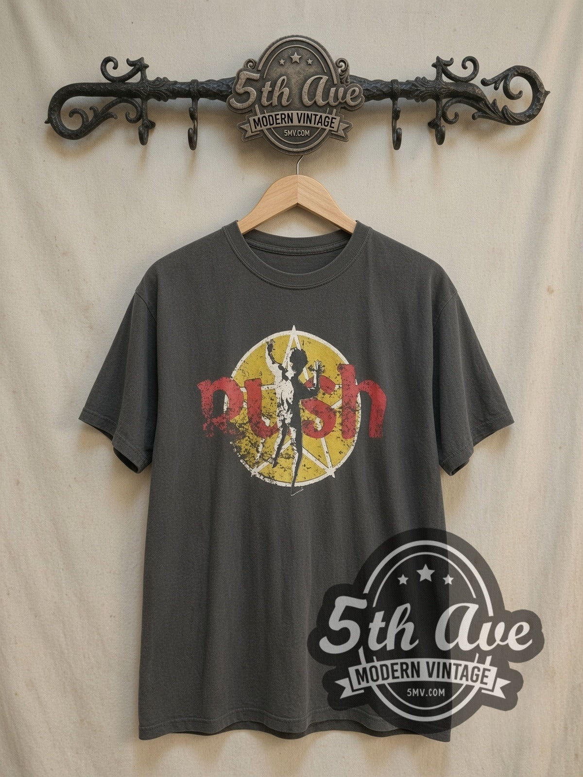 Rush Starman Logo vintage band t-shirt, front view on a display rack
