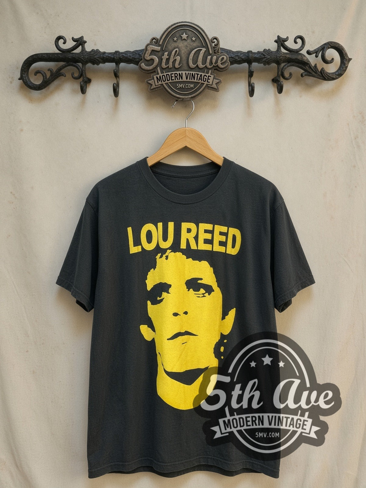 Lou Reed Rock 'n' Roll Animal' Distressed Cotton vintage band t-shirt, front view on a display rack